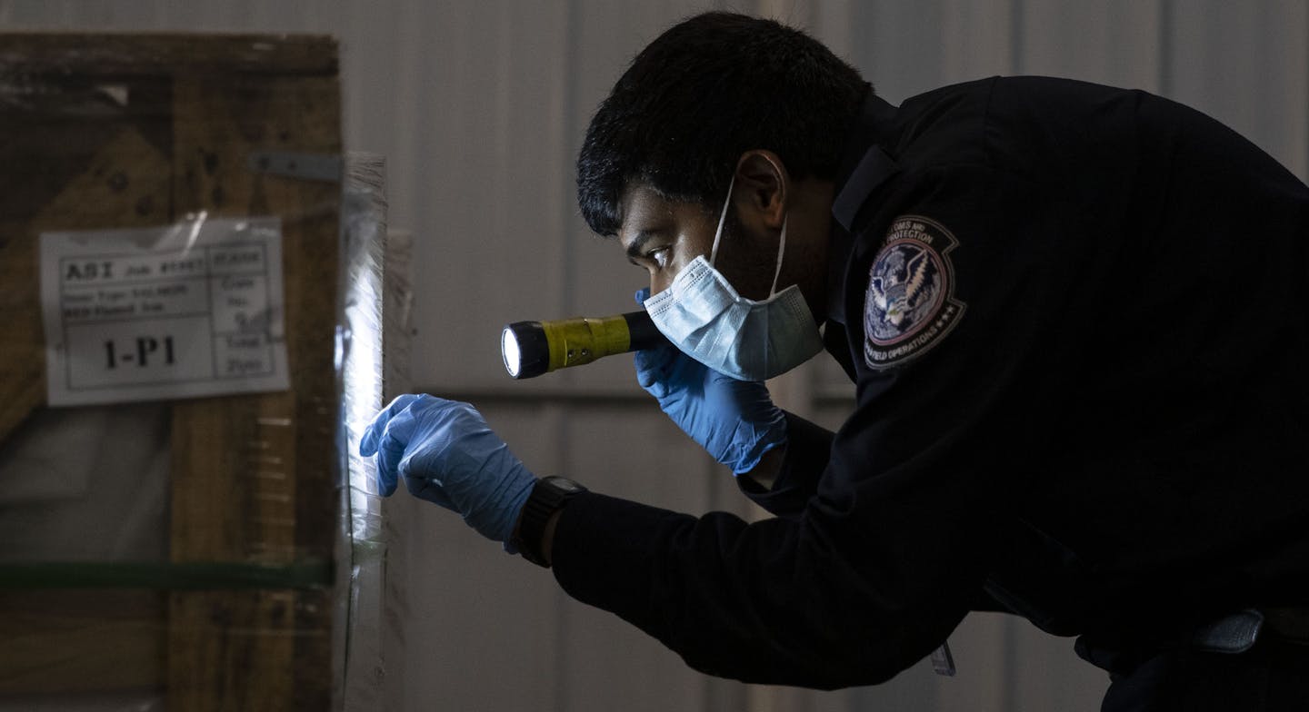 A U.S. Customs and Border Patrol agriculture specialist searched the exterior of a box for bugs and other small pests to be sent in for analysis to determine if they pose a significant risk to the goods. ] ALEX KORMANN • alex.kormann@startribune.com The U.S. Customs and Border Patrol in International Falls, MN has the daunting job of checking the cargo on trains for potential pests and intellectual property rights violations. They overwatch the busiest international rail crossing in the United S