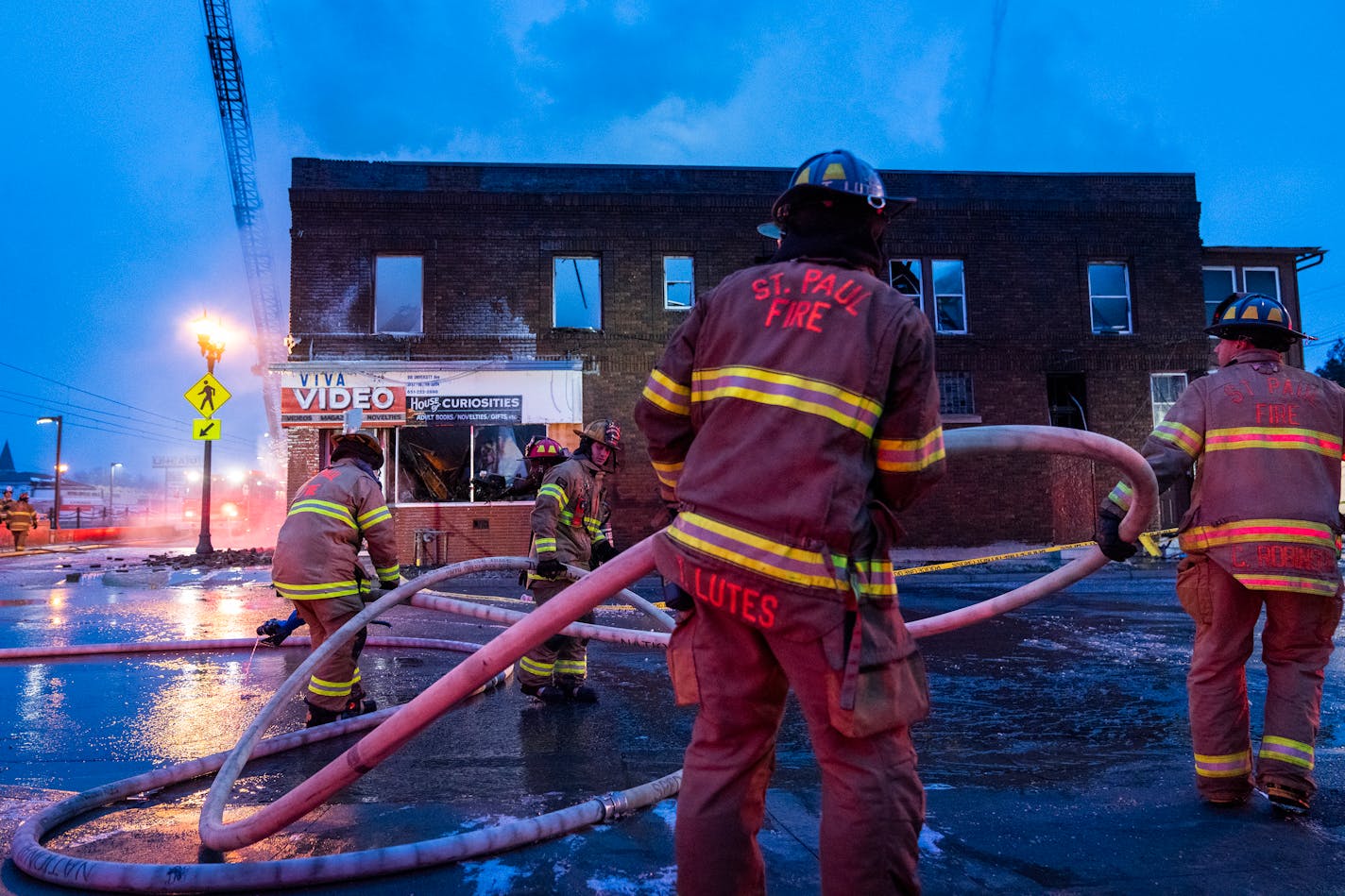 St. Paul Fire Department crews battle a fire that severely damaged a building housing a video store and apartments on University Avenue in St. Paul. in St. Paul, Minn. Wednesday, Jan. 10, 2024. ] LEILA NAVIDI • leila.navidi@startribune.com