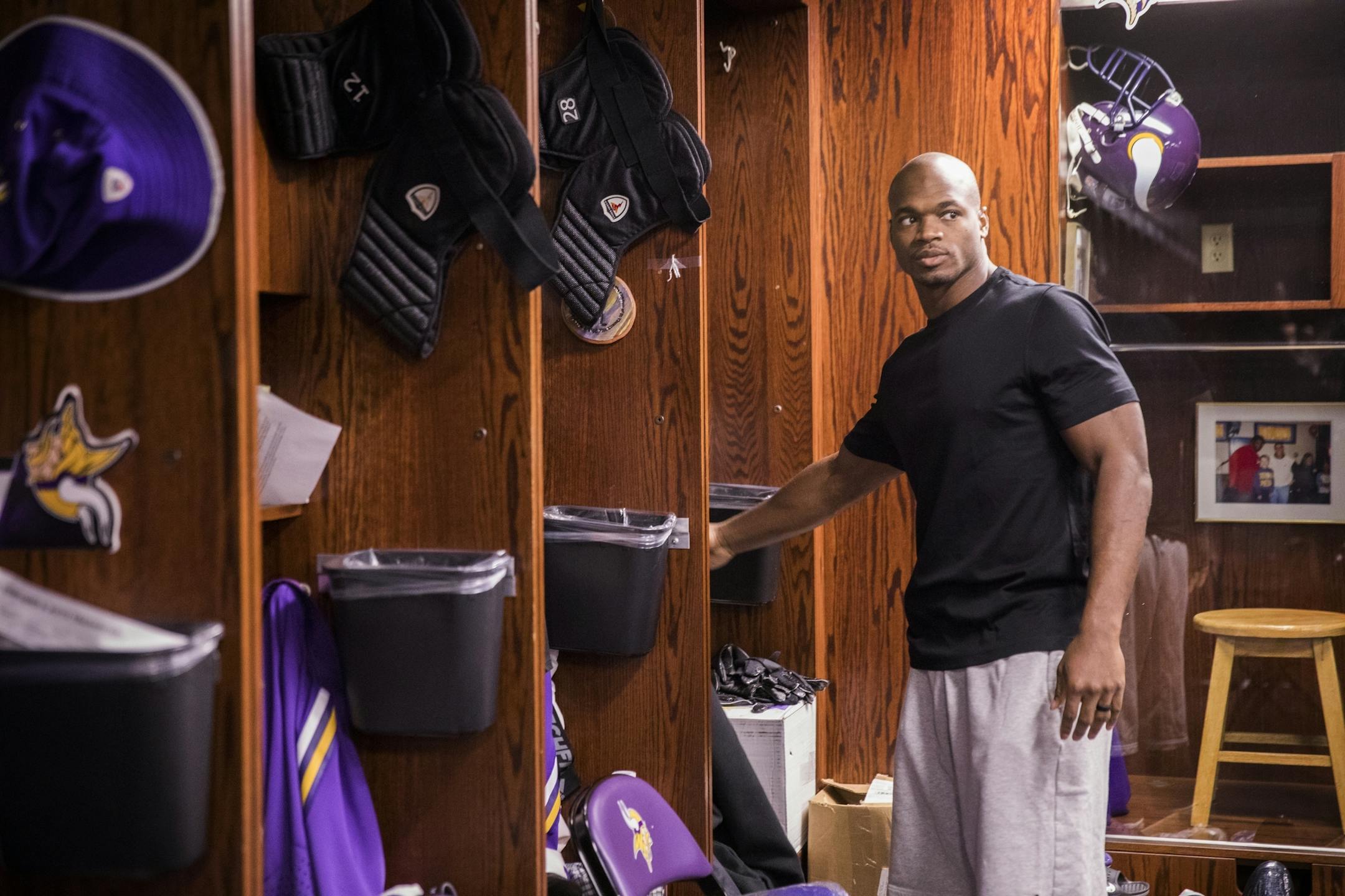 Adrian Peterson cleans out his locker.