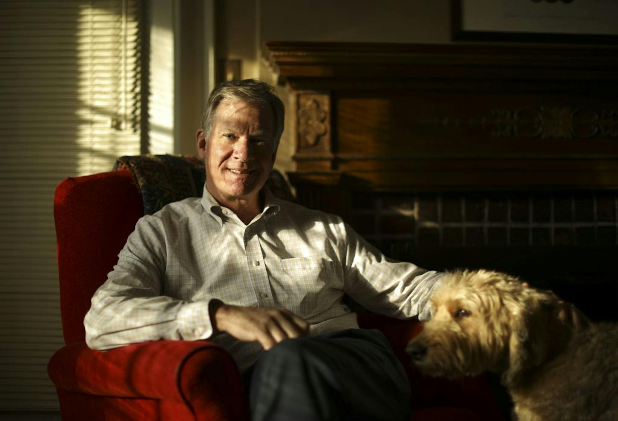 St. Paul Mayor Chris Coleman with his dog, Roscoe, in the living room of his home.