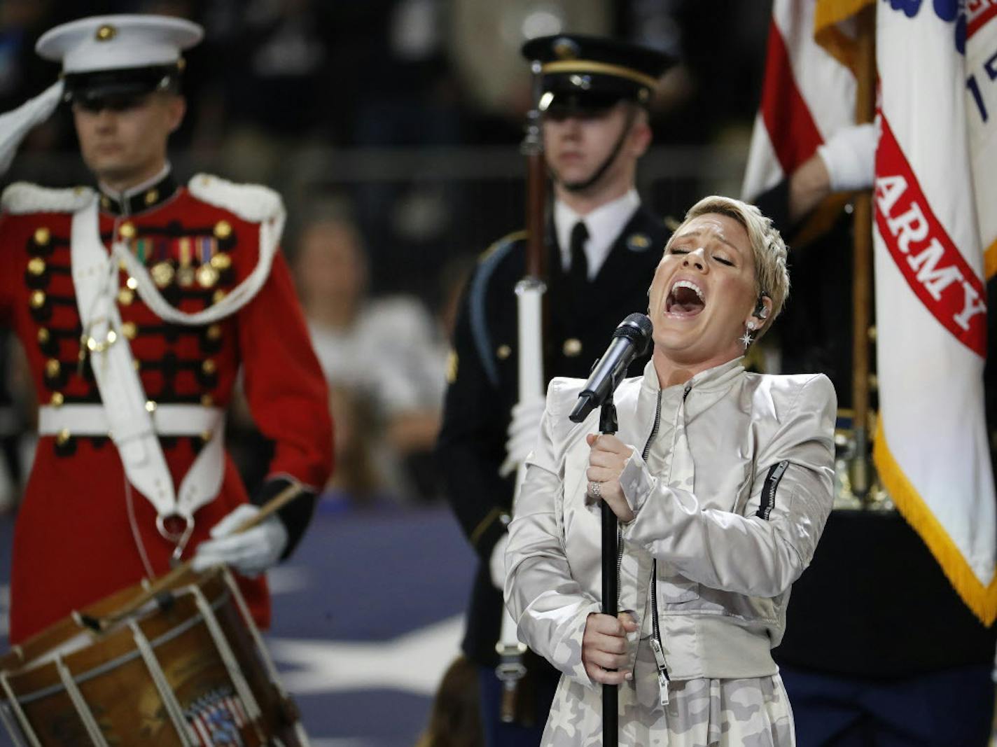 Pink performs the national anthem before the NFL Super Bowl 52 football game between the Philadelphia Eagles and the New England Patriots Sunday, Feb. 4, 2018, in Minneapolis. (AP Photo/Matt York)