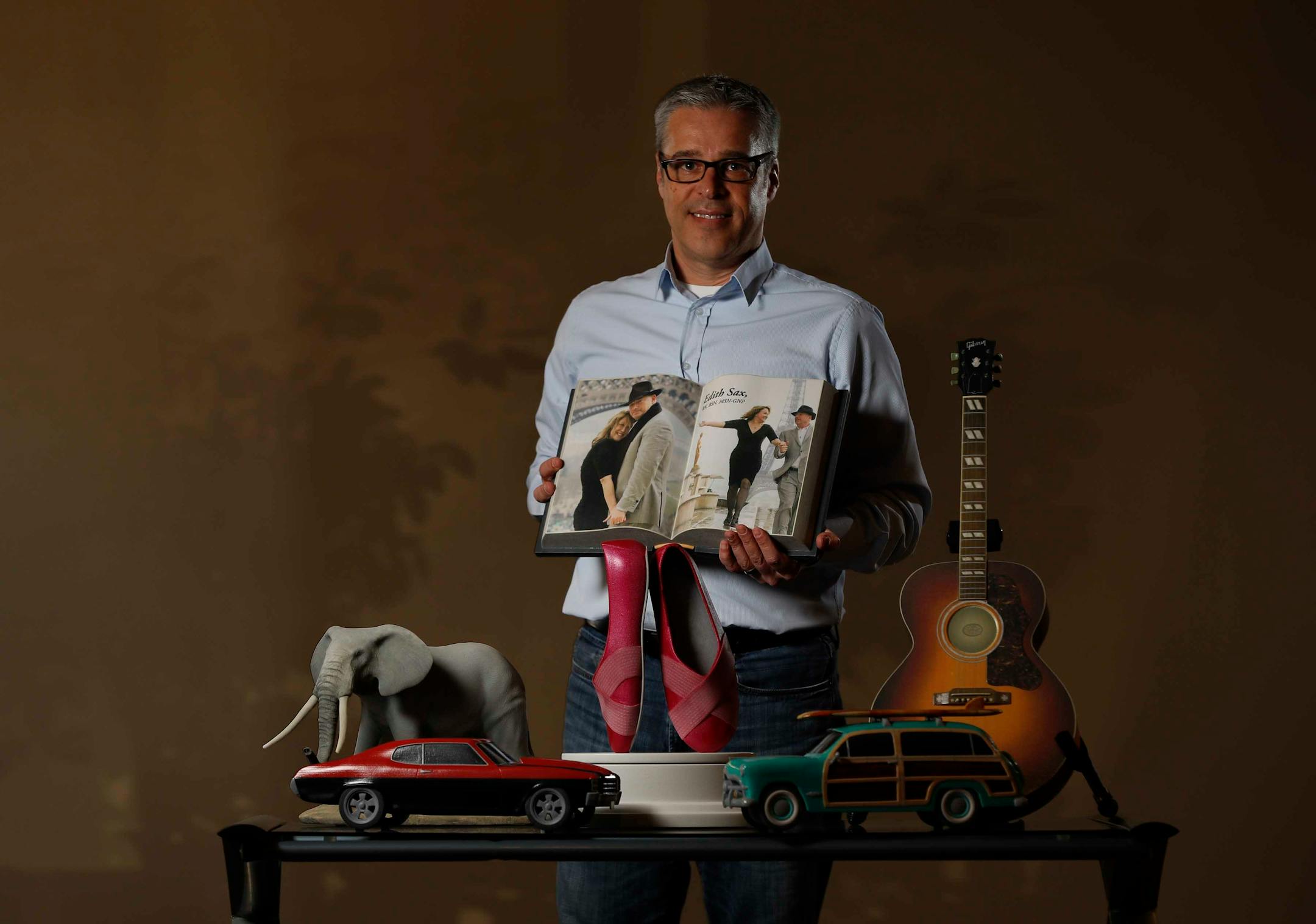 Foreverence owner Pete Saari with a selection of urns that were created by 3- D printing machine used to make customs urns Tuesday March 14, 2017 in Eden Prairie, MN.] JERRY HOLT ï jerry.holt@startribune.com
