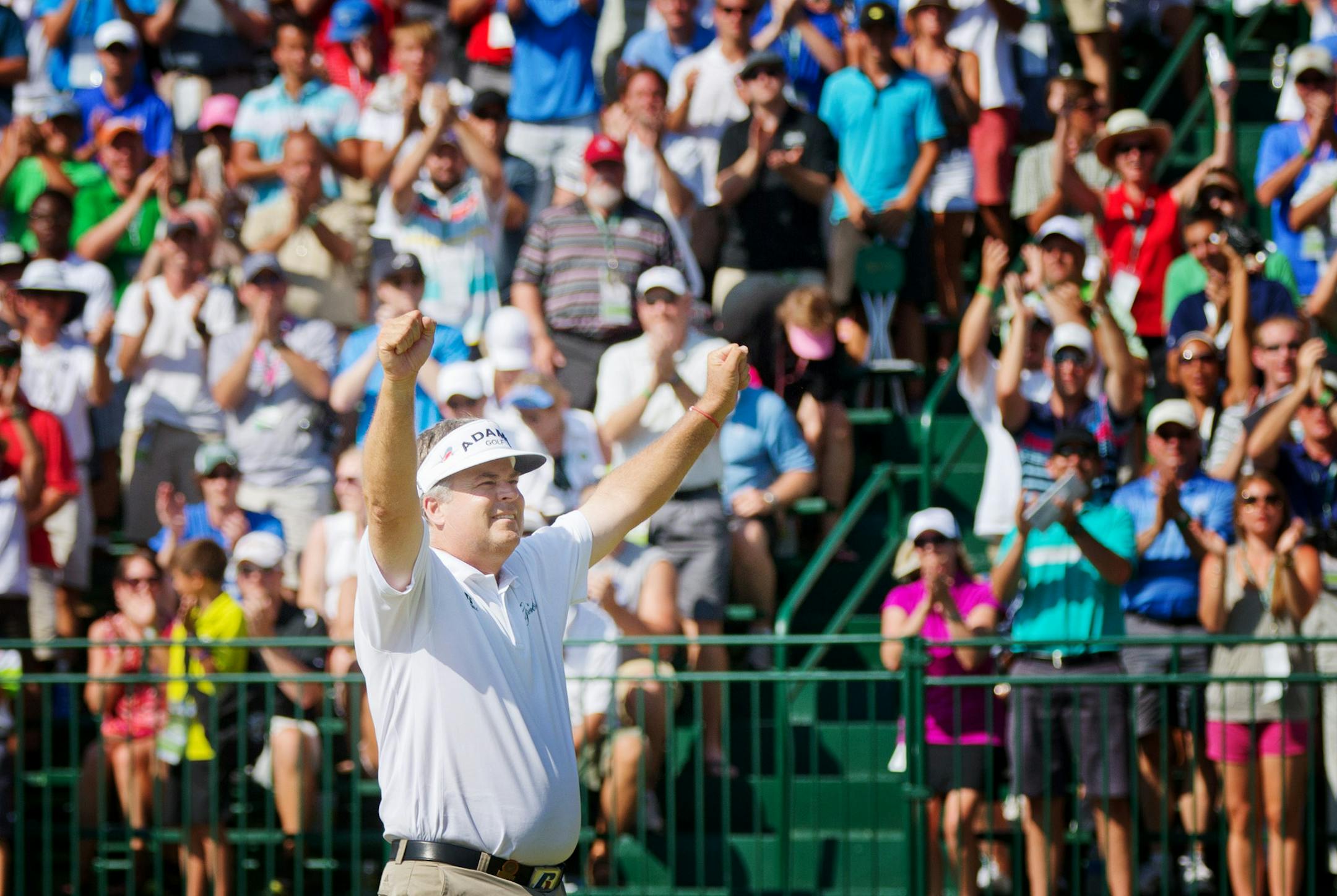 Kenny Perry celebrates his victory after his winning the U.S. Senior Open golf tournament on Sunday, July 14, 2013. (AP Photo/The Omaha World-Herald/Alyssa Schukar)† MAGAZINES OUT; All LOCAL TV OUT ORG XMIT: MIN2013071420551788