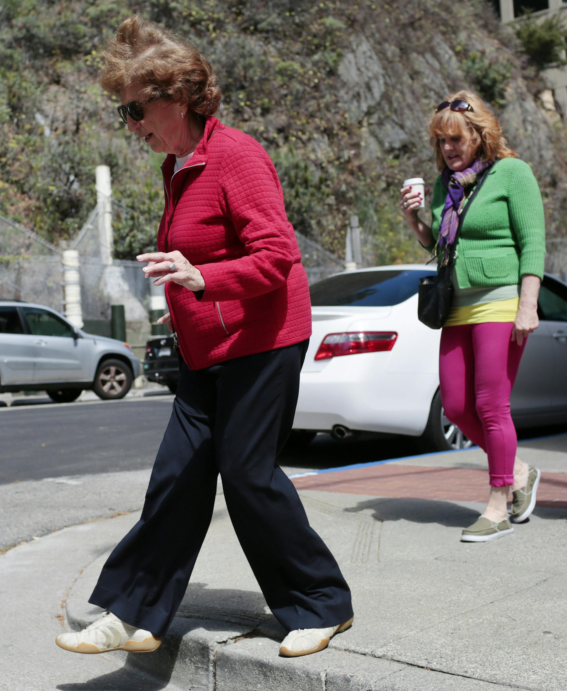 Joan Rees, center, who endured a slow recovery from a fractured pelvis suffered during a fall, and her friends on their weekly Thursday morning walk in San Francisco, July 10, 2014. After a fall, life is upended in an instant — a sudden loss of independence, an awkward reliance on family and friends, and a new level of fear for those who fall, and their contemporaries. (Ramin Rahimian/The New York Times)