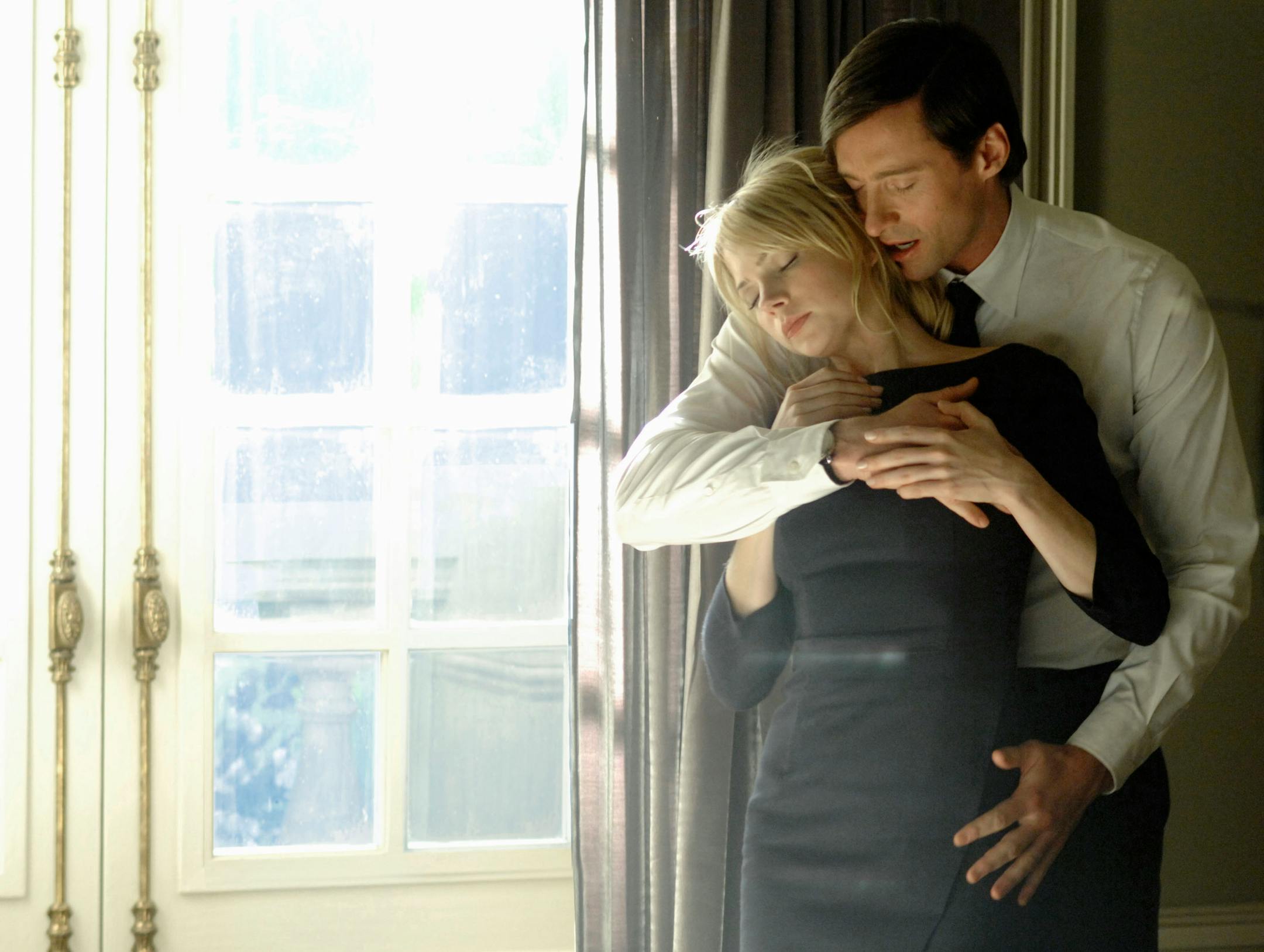 In this image released by 20th Century Fox, Hugh Jackman and Michelle Williams are shown in a scene from "Deception."