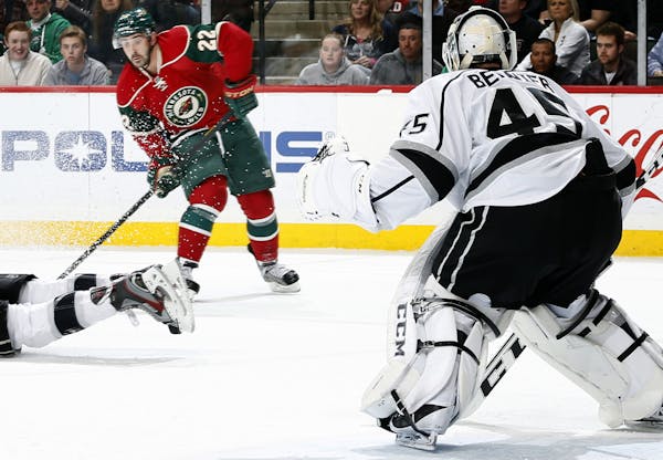 Cal Clutterbuck (22) of the Minnesota Wild prepared to shoot the puck past LA Kings goalie Jonathan Bernier (45) for a goal in the first period. ] CAR