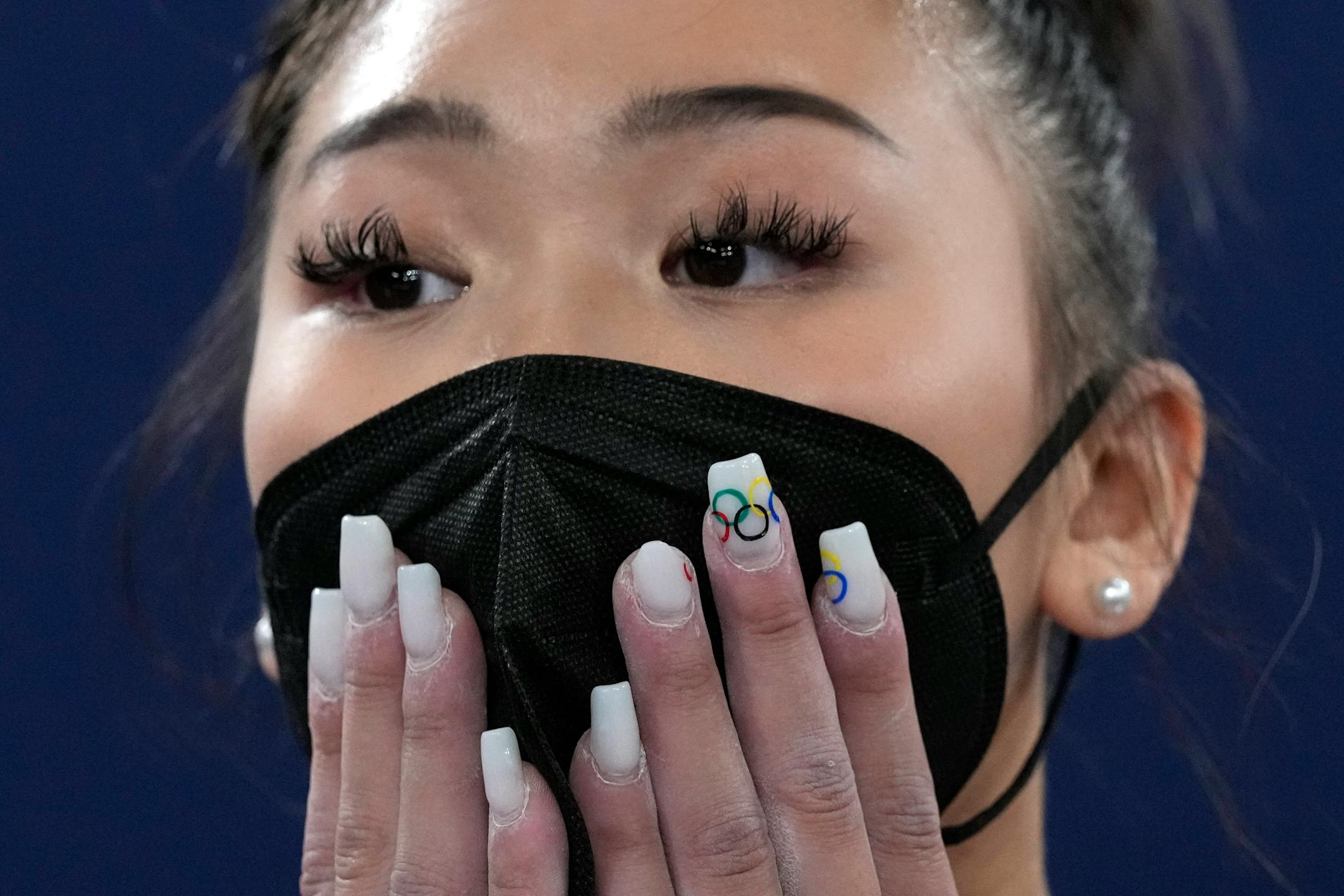 Suni Lee, of the United States, waits for the final results of the artistic gymnastics women's all-around final at the 2020 Summer Olympics, Thursday, July 29, 2021, in Tokyo. (AP Photo/Gregory Bull)