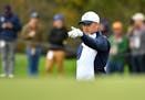Team USA's Jordan Spieth gestured to teammates at the 11th hole during Ryder Cup practice play Wednesday at Hazeltine.