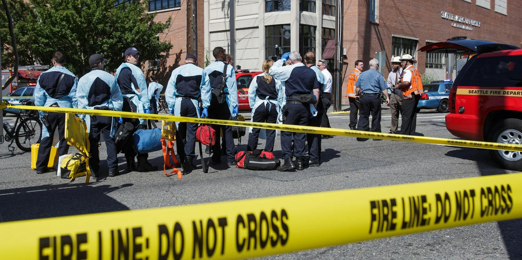 Authorities respond to a shooting at Seattle Pacific University campus Thursday, June 5, 2014, in Seattle. The university posted online Thursday that "the campus is in lockdown due to a shooting near Otto Miller Hall." (AP Photo/The Seattle Times, Dean Rutz) SEATTLE OUT; USA TODAY OUT; MAGS OUT; TELEVISION OUT; NO SALES; MANDATORY CREDIT TO BOTH THE SEATTLE TIMES AND THE PHOTOGRAPHER