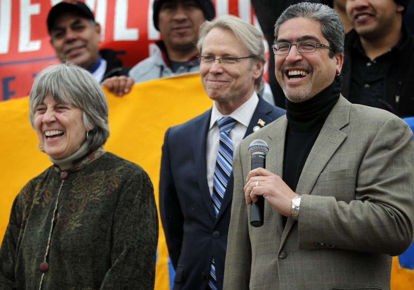 Representatives Karen Clark, Raymond Dehn and Carlos Mariani during May Day March and Rally for immigration reform on Wednesday.