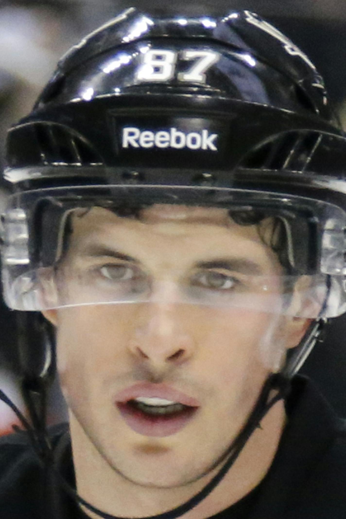 Pittsburgh Penguins' Sidney Crosby (87) prepares to take a face-off during the second period of an NHL hockey game against the Tampa Bay Lightning in Pittsburgh Friday, Jan. 2, 2015.The Penguins won 6-3. (AP Photo/Gene J. Puskar)