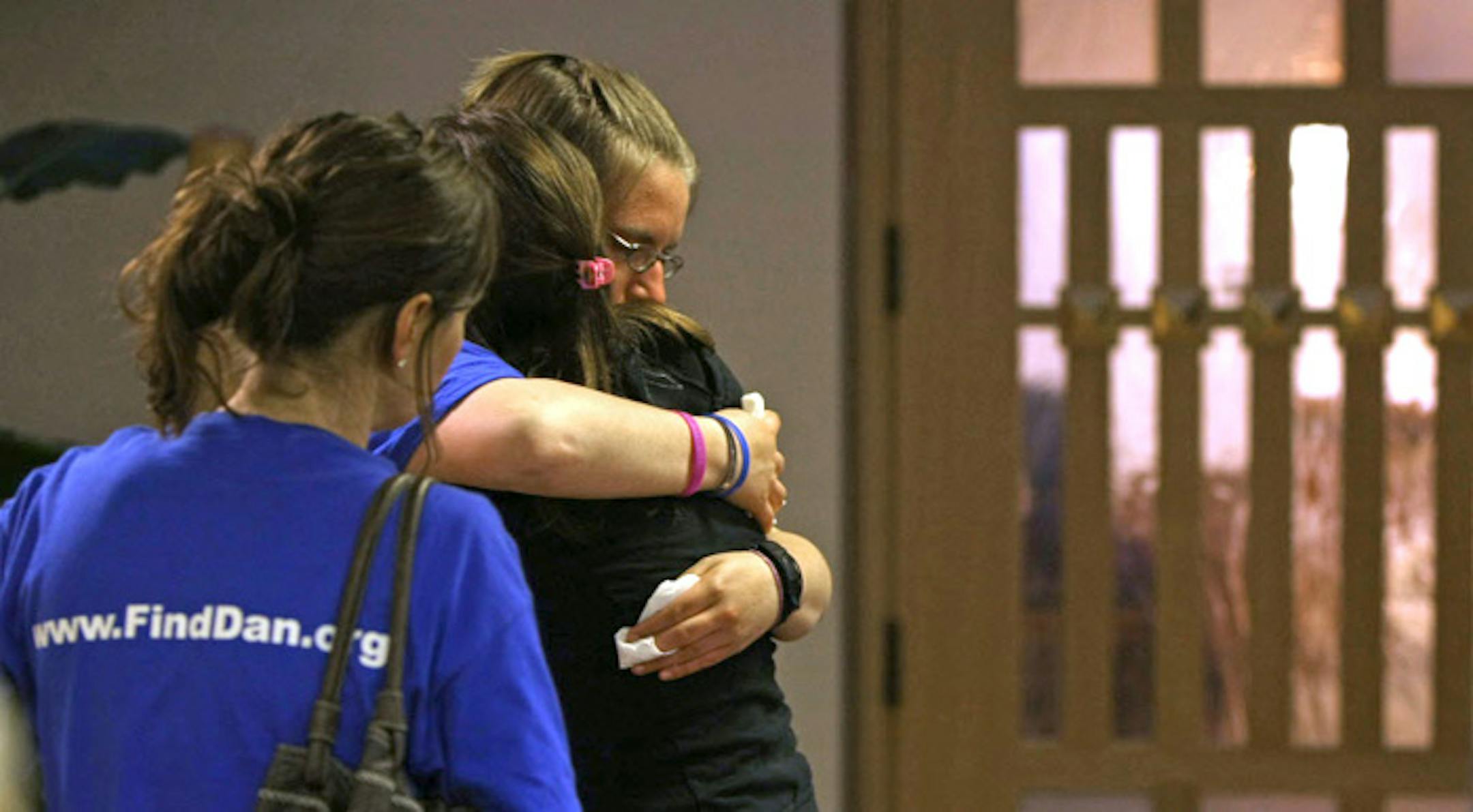 Britta Bloomquist (with glasses) and other mourners hugged each other after a memorial service for Dan Zamlen at St. John Vianney Seminary chapel at the University of St. Thomas.