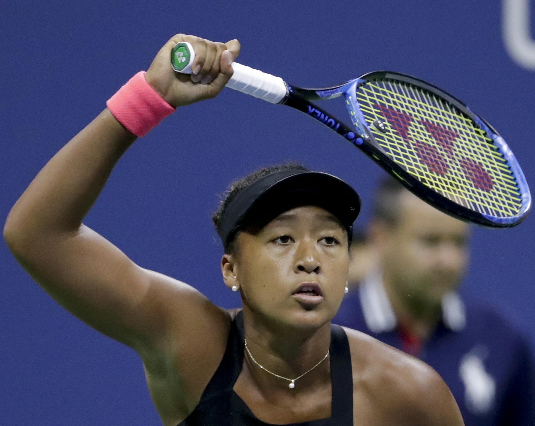 Naomi Osaka, of Japan, returns a shot to Madison Keys during the semifinals of the U.S. Open tennis tournament, Thursday, Sept. 6, 2018, in New York. (AP Photo/Julio Cortez)