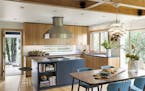 The spacious new kitchen is worthy of avid cooks Brian Smith and Dixie Lee Boschee. Vertical-grain larch cabinets and soapstone counters warm up the s