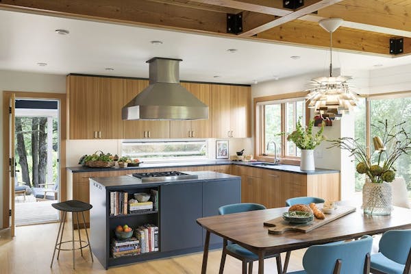 The spacious new kitchen is worthy of avid cooks Brian Smith and Dixie Lee Boschee. Vertical-grain larch cabinets and soapstone counters warm up the s