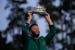 Jon Rahm, of Spain, celebrates holding the Masters trophy winning the Masters golf tournament at Augusta National Golf Club on Sunday, April 9, 2023, 