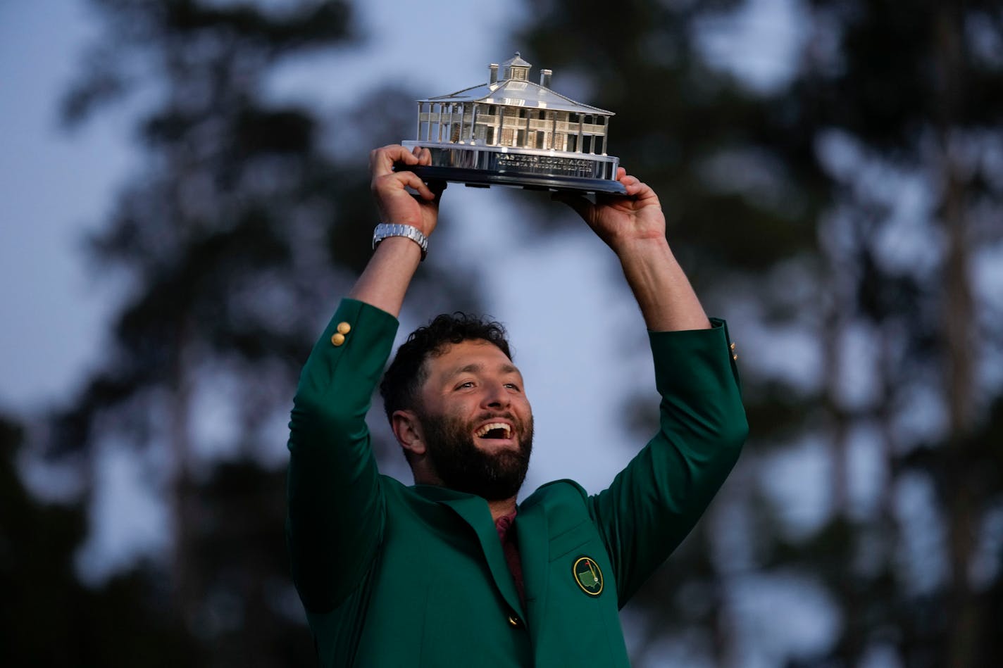 Jon Rahm, of Spain, celebrates holding the Masters trophy winning the Masters golf tournament at Augusta National Golf Club on Sunday, April 9, 2023, in Augusta, Ga.(AP Photo/)