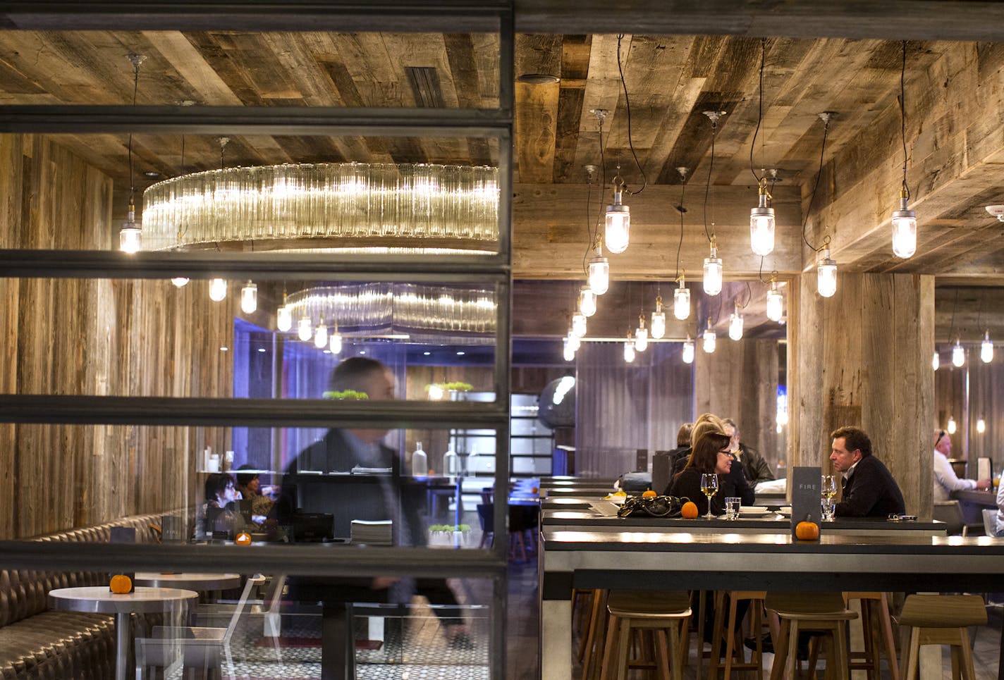 The bar area (seen here) and the entire dining space are finished with reclaimed Minnesota barn wood at FireLake Grill House & Cocktail Bar in the Radisson Blu hotel at Mall of America in Bloomington November 7, 2013. (Courtney Perry/Special to the Star Tribune)