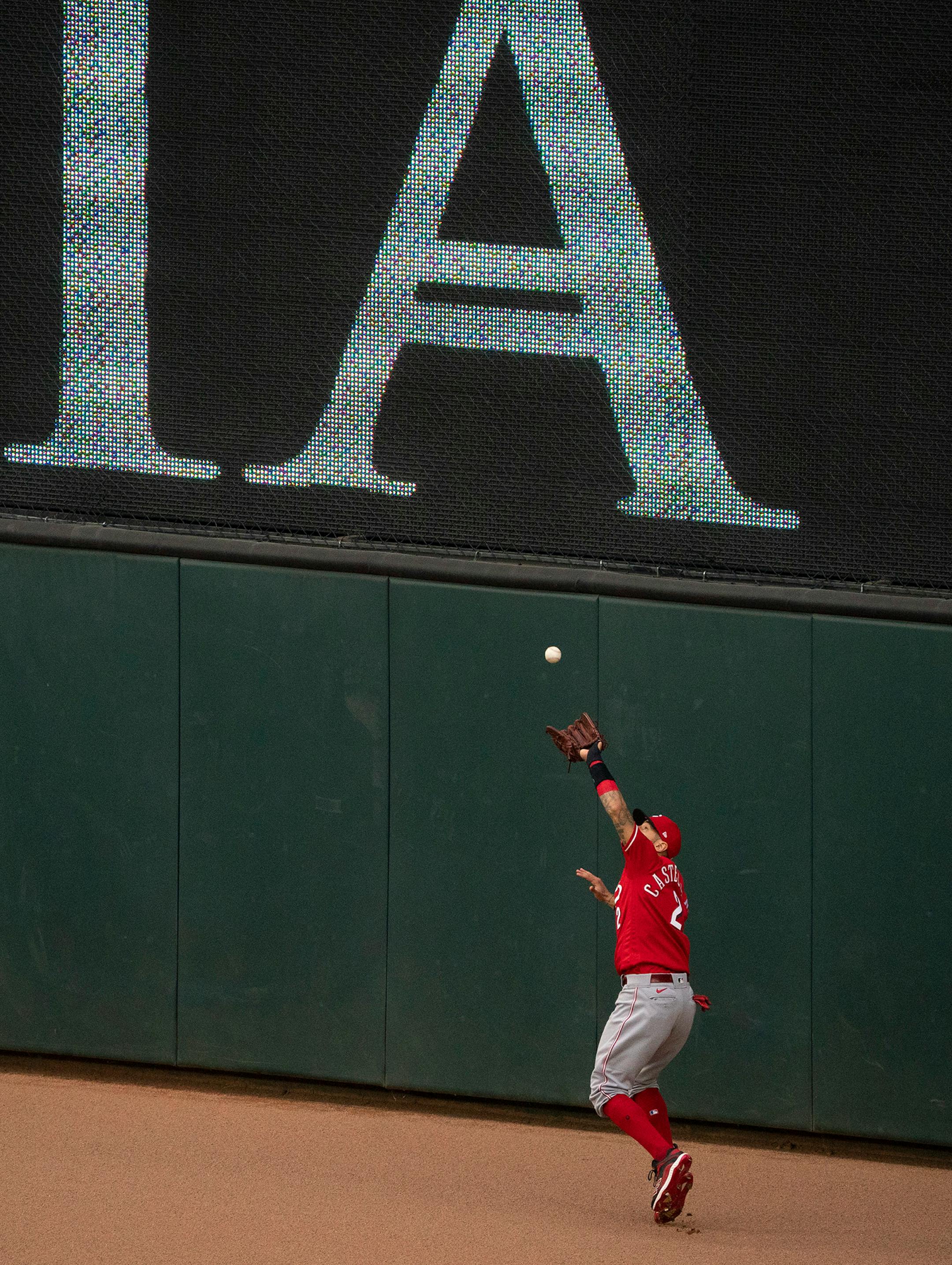 Cincinnati Reds right fielder Nick Castellanos (2) caught a sacrifice fly by Minnesota Twins left fielder Eddie Rosario (20) that allowed Twins right fielder Max Kepler (26) to score the go ahead run in the sixth inning.