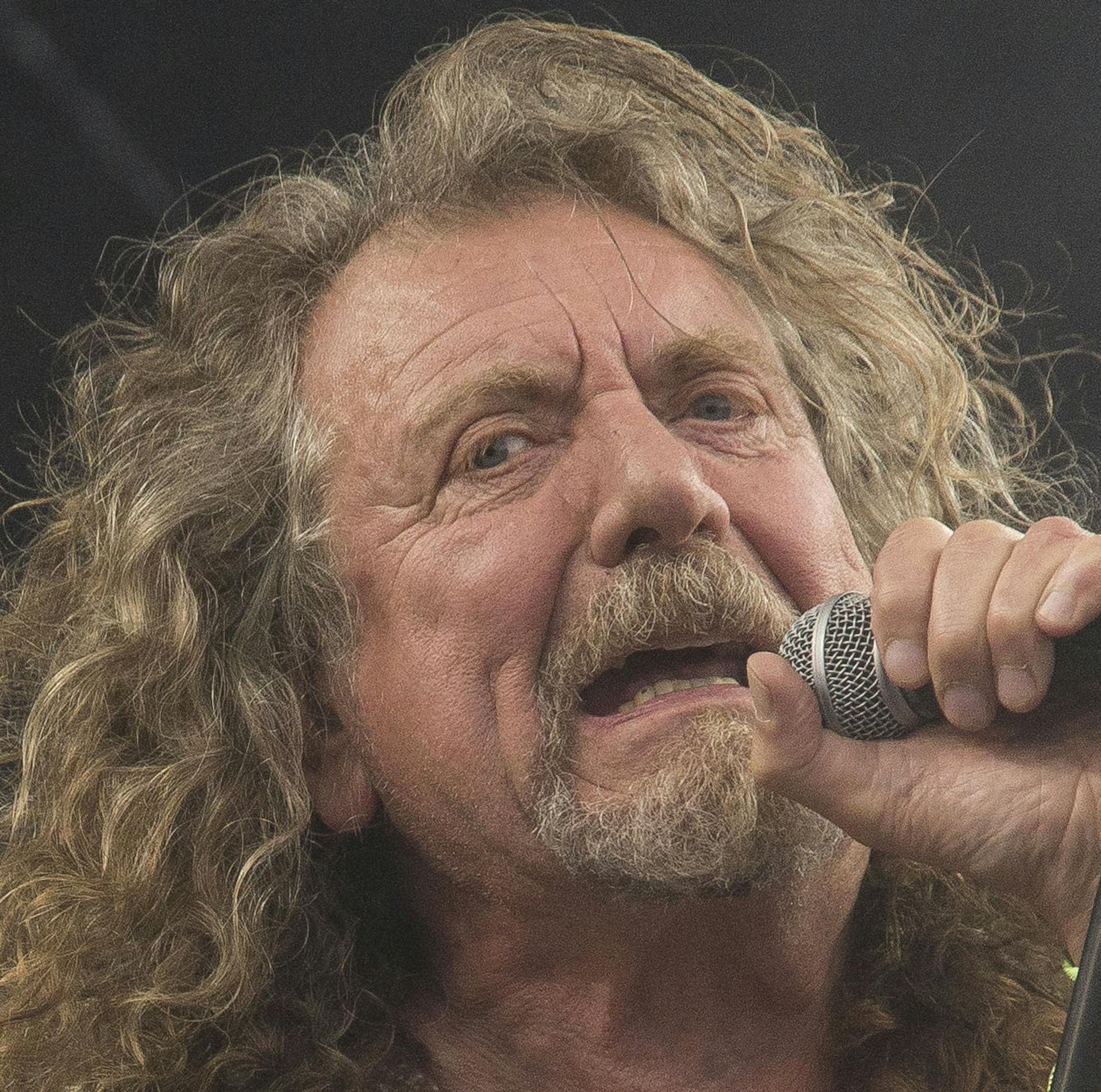 CORRECTS CAPTION TO NOTE THAT GARLAND IS A RESTAURANT IN RALEIGH - FILE - In this June 28, 2014 file photo, Robert Plant performs on the Pyramid main stage at Glastonbury music festival, in England. Plant and his backing band, Sensational Space Shifters, made their way to Garland restaurant in Raleigh, N.C., after kicking off their U.S. tour on Friday, Feb. 9, 2018, but the eatery was closed. The restaurant’s owners showed them a whole lotta love by feeding them free of charge. (Photo by