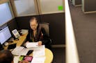 Lois Horowitz, senior tax consultant with H&R Block in Manhattan, checks out a client's tax documents during an appointment in New York, Jan. 31, 2017