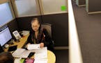 Lois Horowitz, senior tax consultant with H&R Block in Manhattan, checks out a client's tax documents during an appointment in New York, Jan. 31, 2017