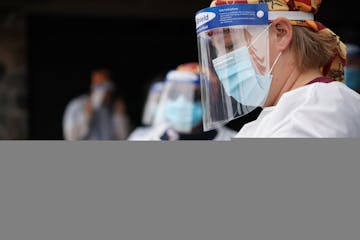 Rachel Miller, an EMS with M Health Fariview, conducted COVID-19 tests during a free testing event at New Salem Baptist Church in Minneapolis on Aug. 