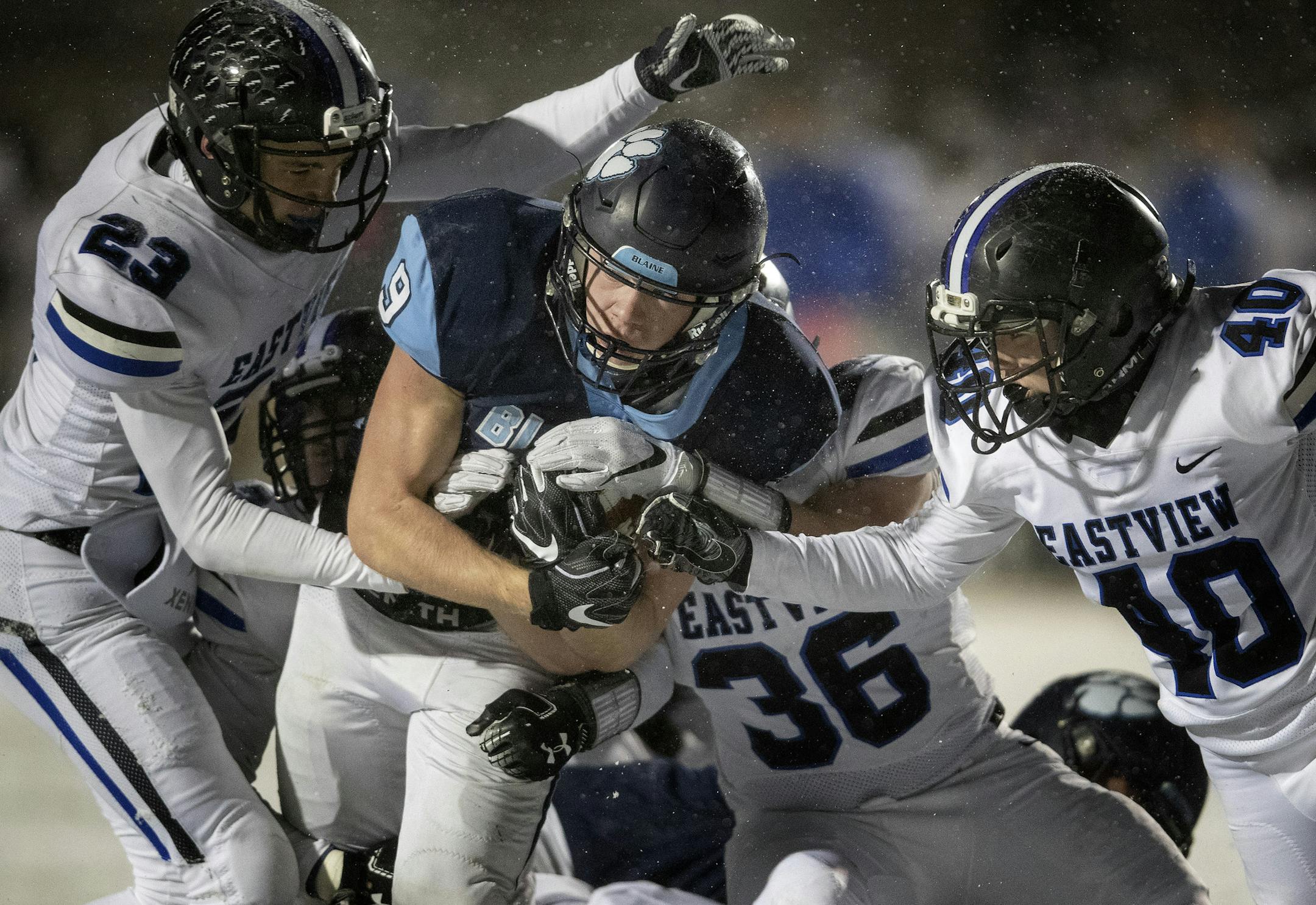 Will Fredrickson (9) of Blaine was surrounded by Eastview defenders in the second quarter. ] CARLOS GONZALEZ • cgonzalez@startribune.com – White Bear Lake, MN – November 8, 2018, High School / Prep state tournament football quarterfinals, Blaine vs. Eastview