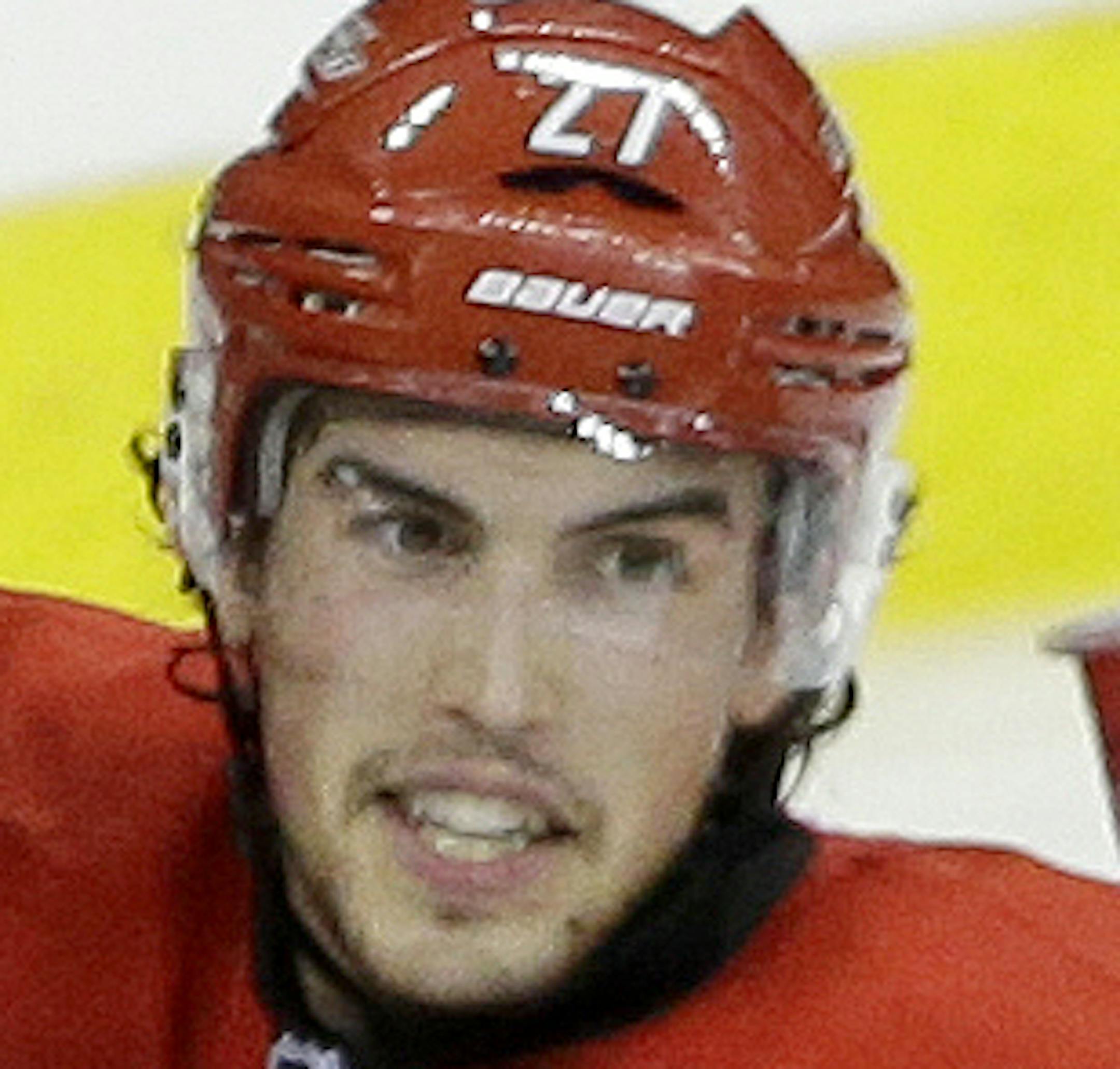 Carolina Hurricanes goalie Cam Ward (30) is congratulated by Justin Faulk (27) following the Hurricanes 1-0 win over the Buffalo Sabres in an NHL preseason hockey game on Friday, Sept. 27, 2013, in Raleigh, N.C. (AP Photo/Gerry Broome)