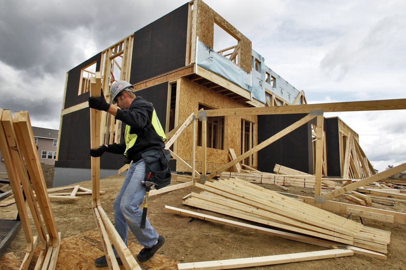 Construction of a single-family house in the Lennar Bonaire development - the 18900 block of 62 Ave N in Maple Grove. Construction worker Jeff Kowalke worked on the roof supports of the house.