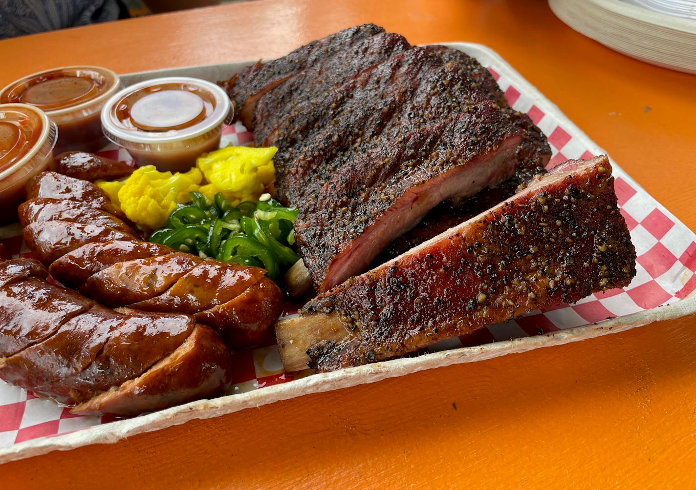 Image of Animales ribs, which have changed only ever so slightly since chef/owner Jon Wipfli first opened his smoker trailer. Photo by Joy Summers