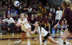 Minnesota setter Samantha Seliger-Swenson (13) and defensive specialist Lauren Barnes (2) went low for a dig vs. Penn State earlier this season.