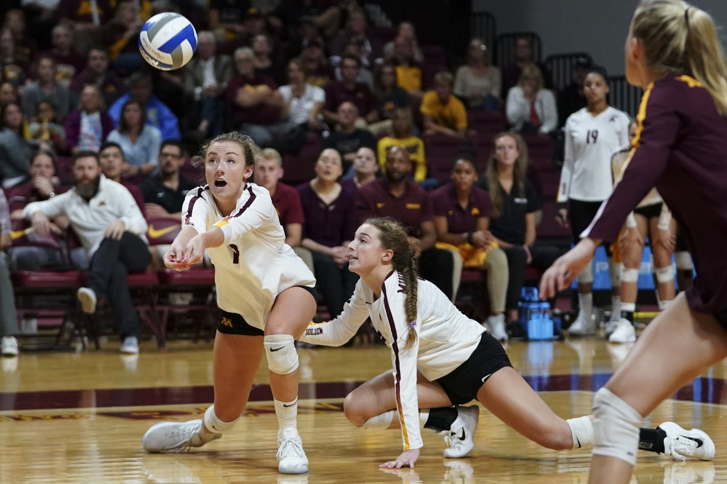 Minnesota setter Samantha Seliger-Swenson (13) and defensive specialist Lauren Barnes (2) went low for a dig vs. Penn State earlier this season.