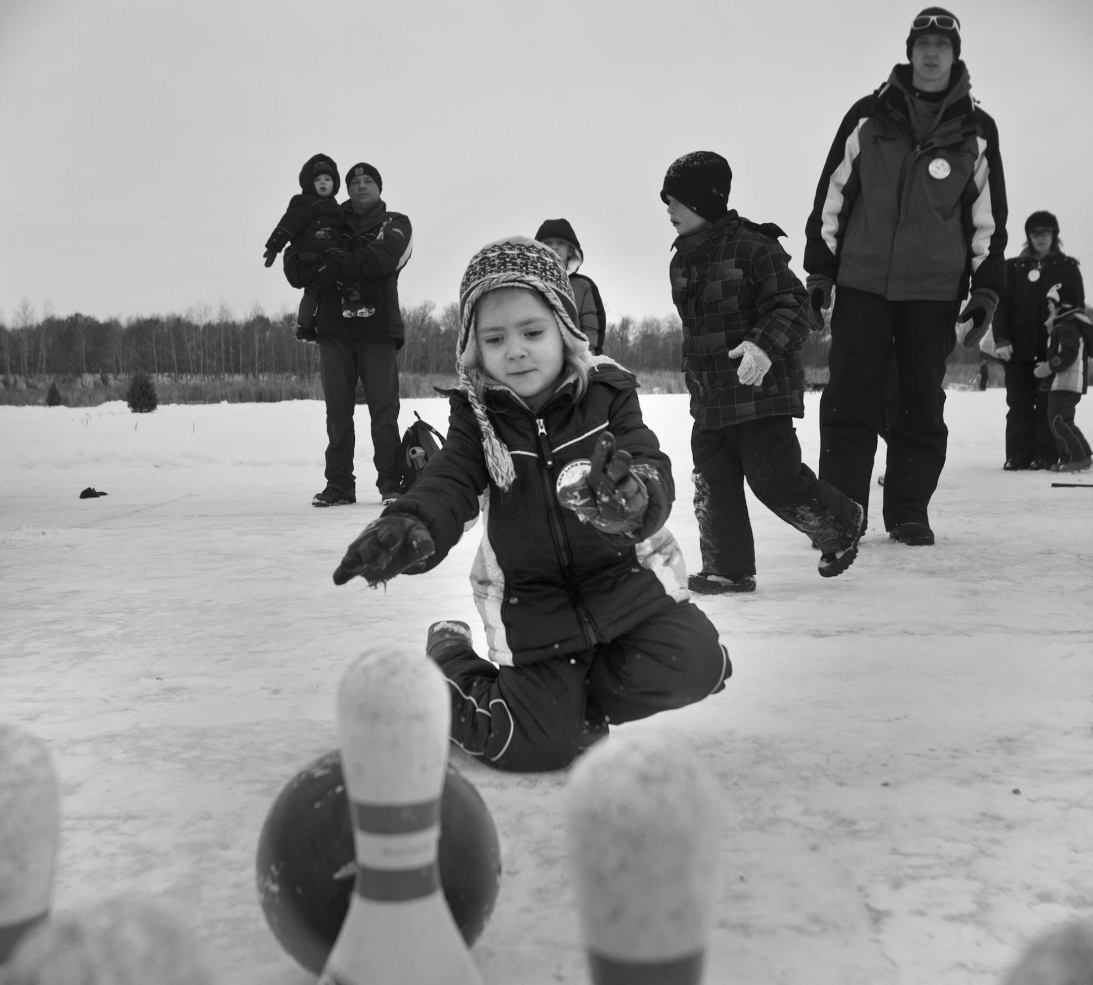 Five-year-old Jada Bennett pushed a bowling ball towards bowling pins set up on frozen Ham Lake. The seventh annual Snowbowl took place on Febuary 9, 2013 in Ham Lake Park. ] NICOLA LOSIK* nicola.losik@startribune.com
