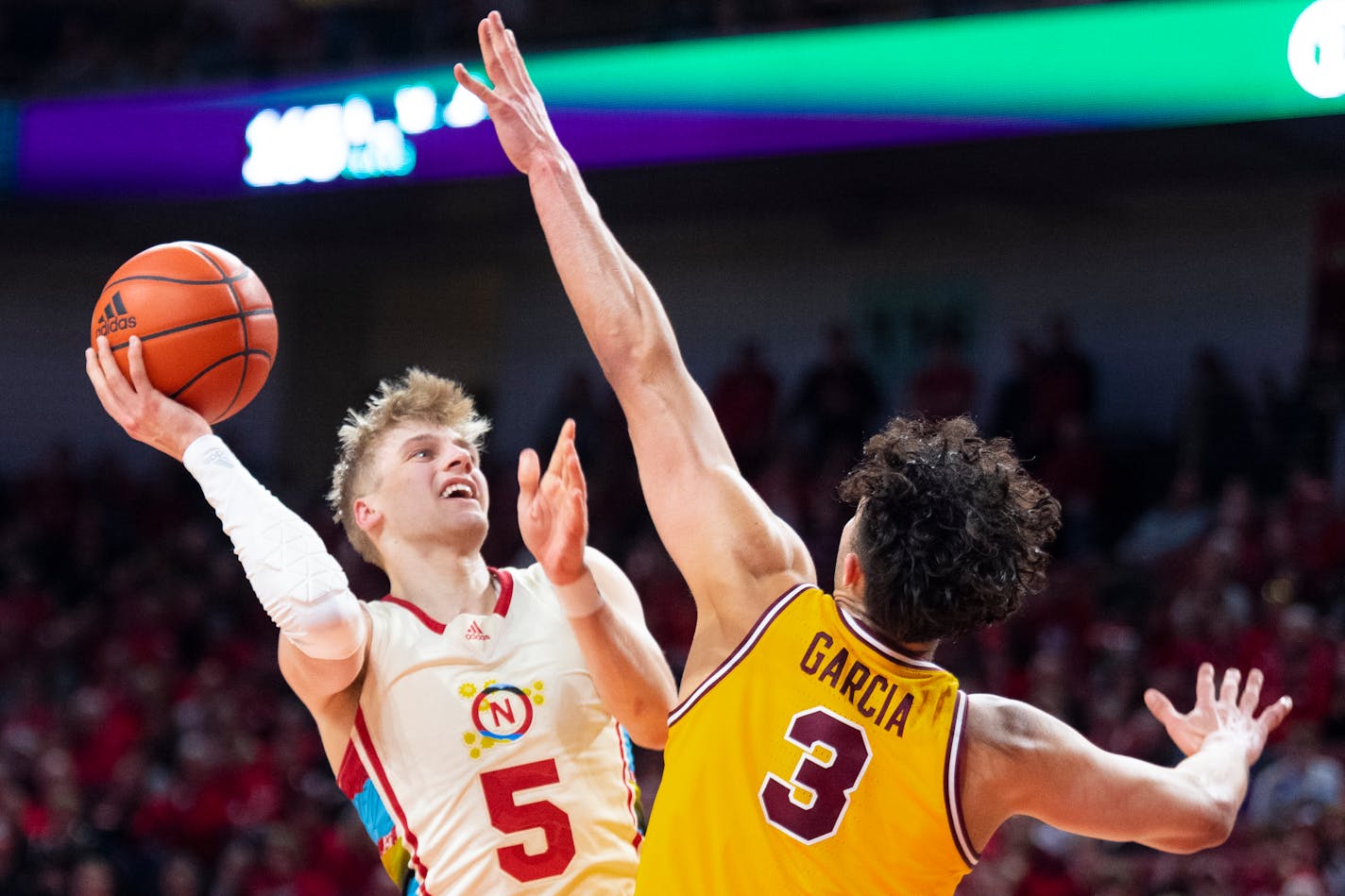 Nebraska's Sam Griesel scores in the paint over Minnesota's Dawson Garcia during the second half Saturday at Pinnacle Bank Arena in Lincoln, Neb.