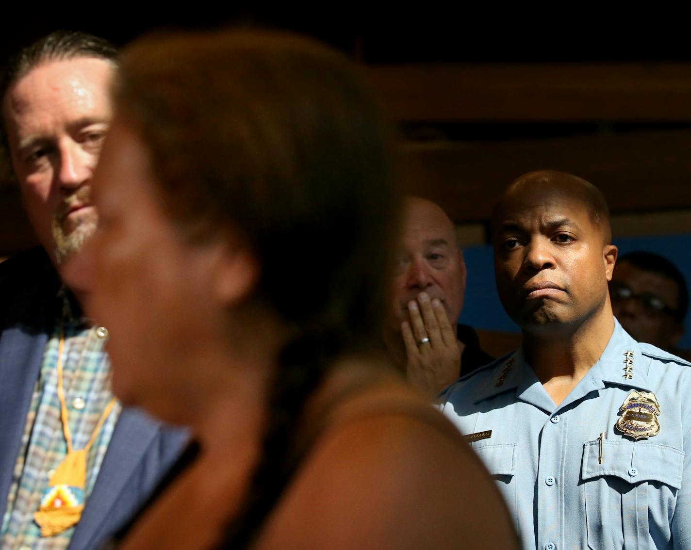 Mayor Jacob Frey and leaders from the American Indian community, among others, will outline their plan to assist people living in a homeless encampment near Hiawatha and Cedar Avenues in south Minneapolis. The encampment of mostly American Indians has grown rapidly in size, raising health and safety concerns. Here, Minneapolis Police Chief Medaria Arradondo, right, listened to a homeless woman talk about the encampment Thursday, Aug. 23, 2018, at the American Indian Center in Minneapolis, MN.