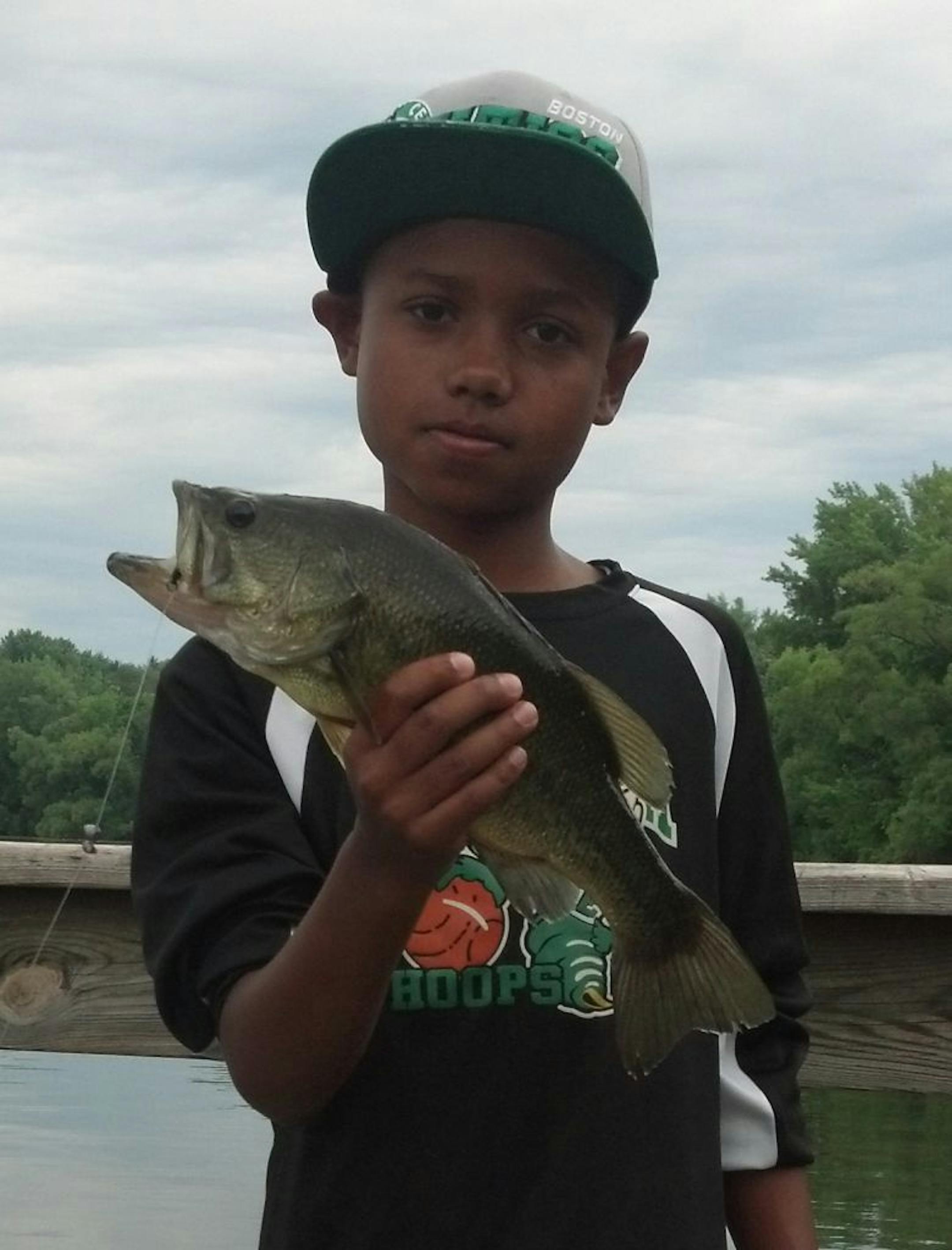 PIER PRESSURE Langston Edlund, 10, of Edina, caught this largemouth bass at Lake Ann in Chanhassen off the fishing pier. "I had already reeled my line in after a fun day of fishing, and I asked Langston to bring his line in, too,'' said Langston's dad, Paul. "It was right then that this big fella went after Langston's sucker minnow. After a few photo's we released the fish.''