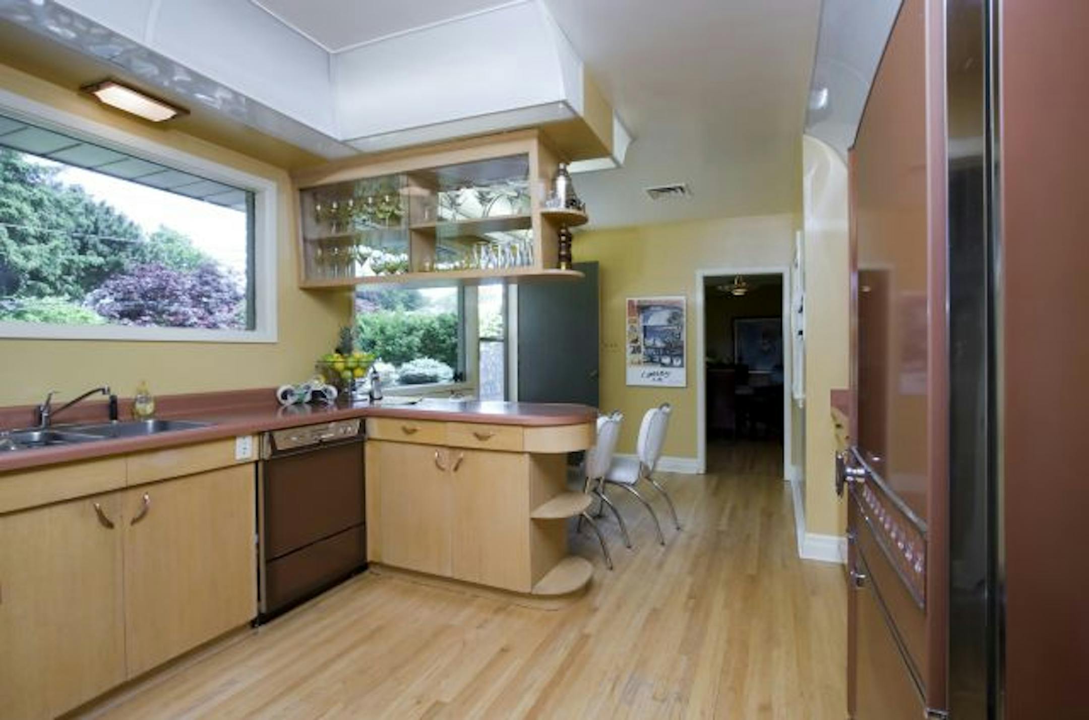 BEFORE This ranch-style bungalow hadn't changed much since it was built in the '60s, time-capsule perfect with copper-colored appliances and a melamine table.