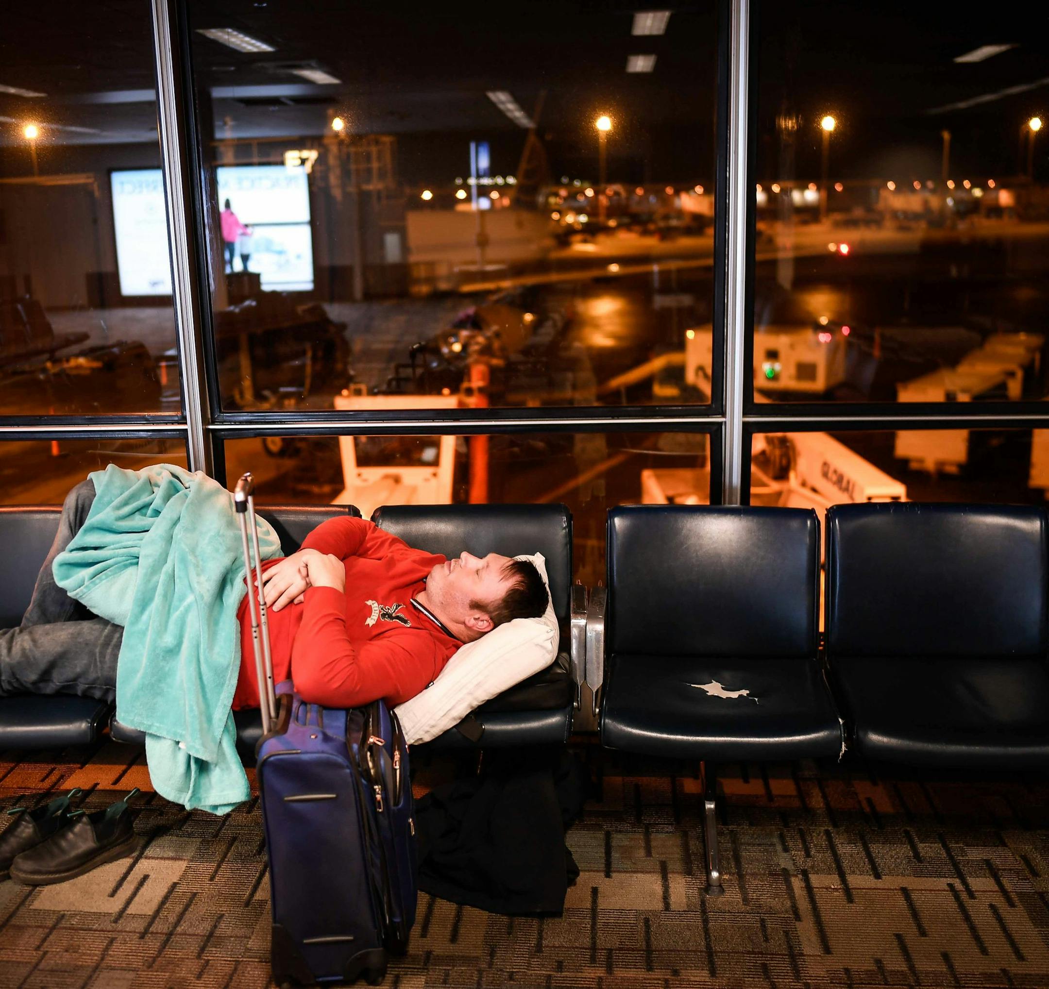 Weary from his travels, Edward Balika rested his eyes at 2:31 am Friday morning. He was waiting to catch a flight to visit family in Seattle for the holidays. ] AARON LAVINSKY ï aaron.lavinsky@startribune.com Thursday and Friday are among the busiest days of the holiday travel season at the Minneapolis-St. Paul International Airport. MSP is a 24/7 city unto itself, but who are its night dwellers? Who shovels the tarmac after midnight, bakes the croissants, swabs the toilets and drives the c