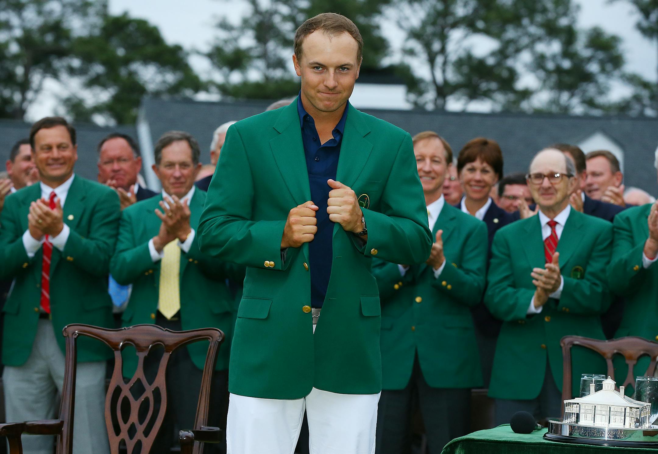 Jordan Spieth beams as he snugs up his green jacket after winning the Masters on Sunday, April 12, 2015, at Augusta National Golf Club in Augusta, Ga. (Curtis Compton/Atlanta Journal-Constitution/TNS)