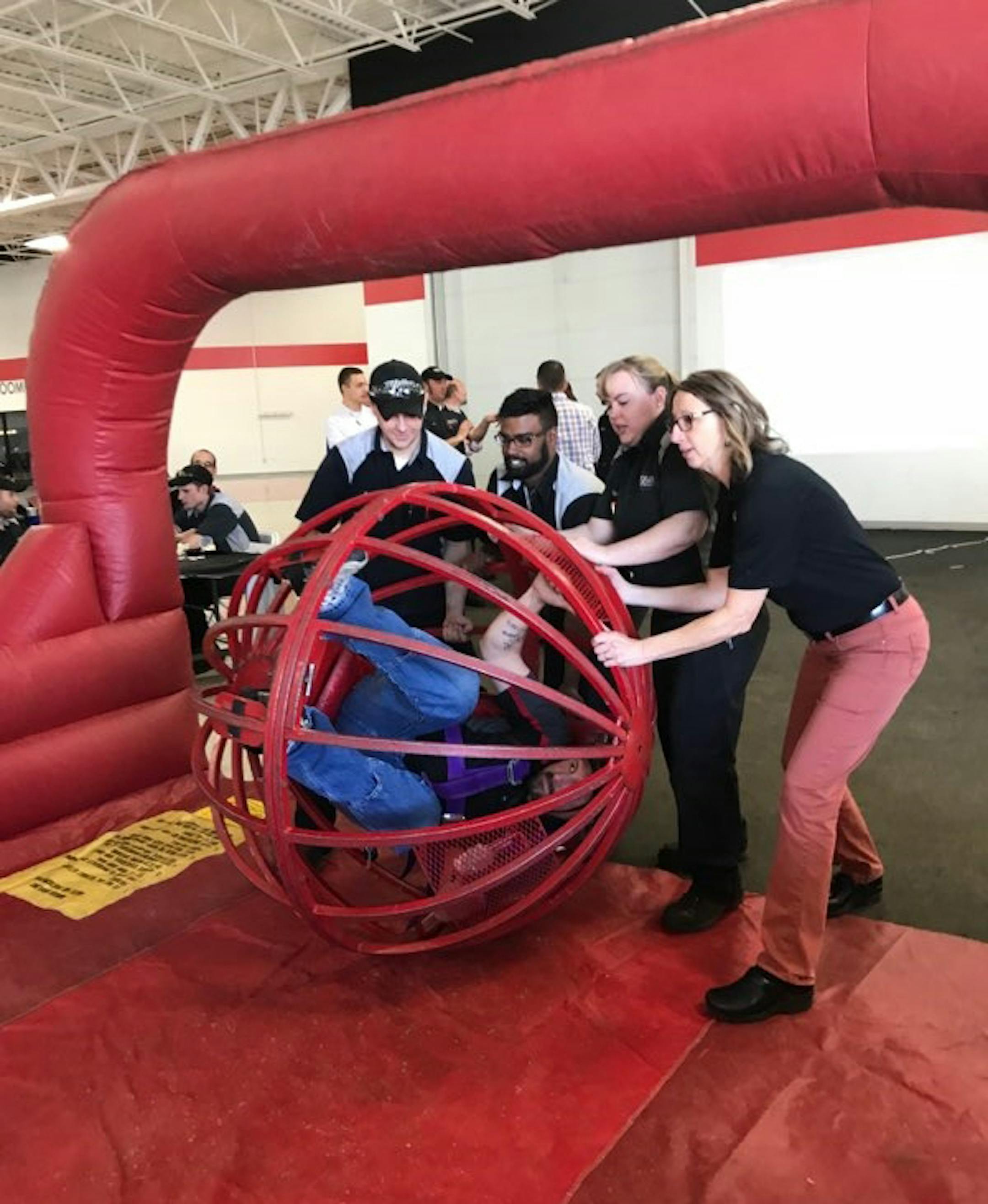 Miller Auto & Marine workers go human bowling as part of a team building exercise at a quarterly annual meeting. provided