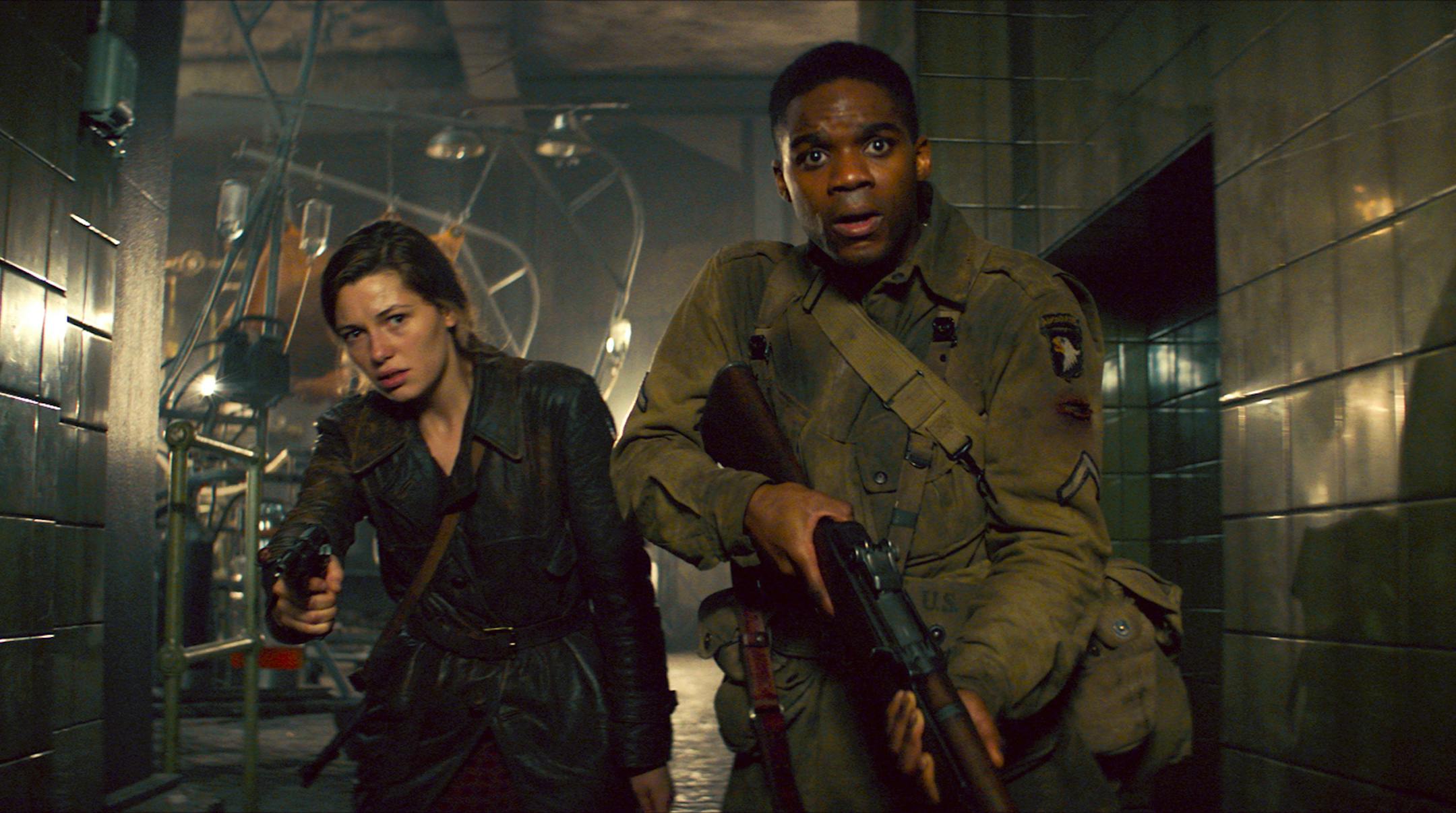 (L-R) Mathilde Ollivier as Chloe, Jovan Adepo as Boyce in the film "Overlord." Photo credit: Peter Mountain/Paramount Pictures