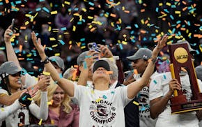 FILE - South Carolina head coach Dawn Staley celebrates after a college basketball game in the final round of the women's Final Four NCAA tournament a