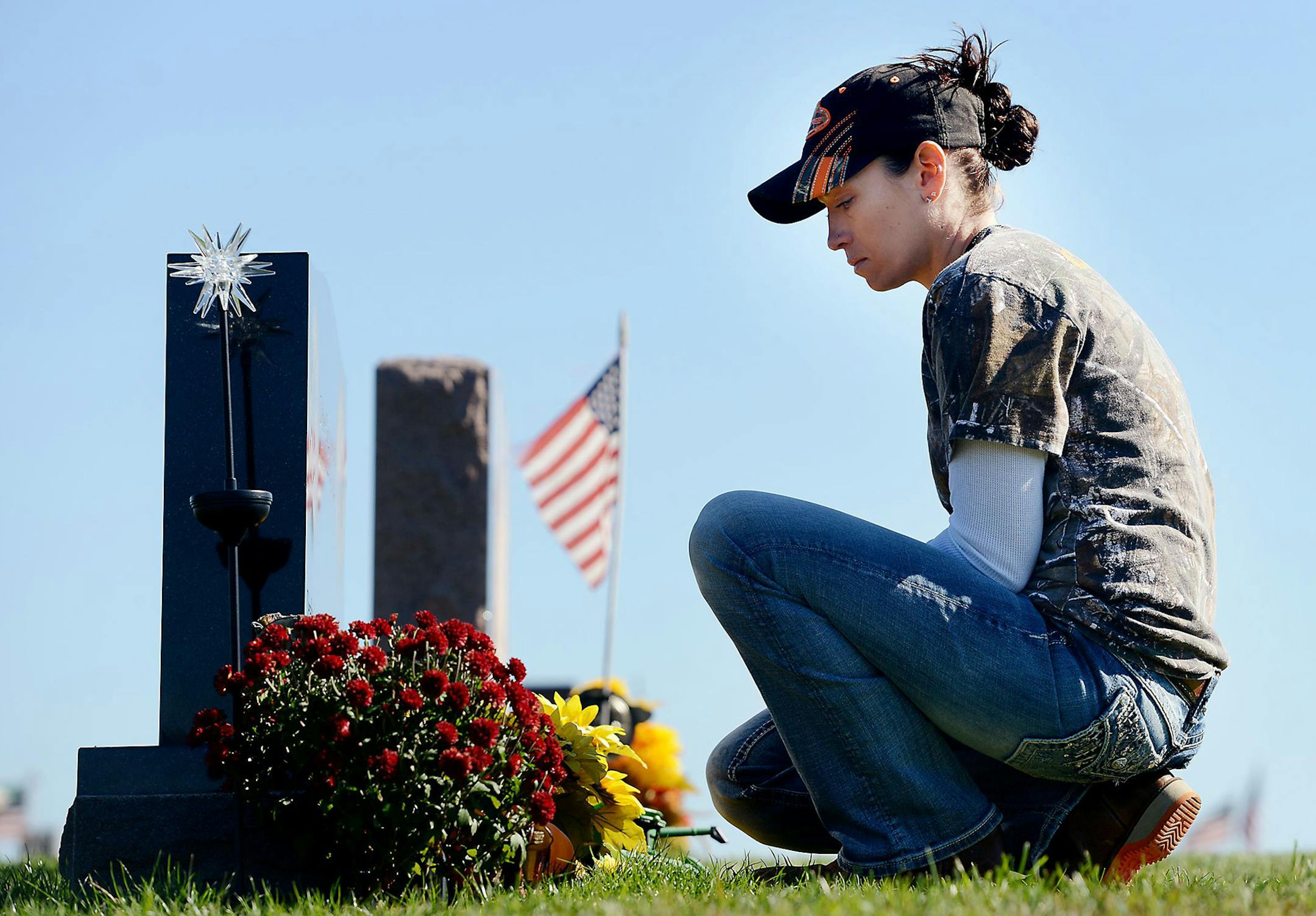Kelli Jo Lovich visits the grave of her 4-year-old son, Colbee, in mid-October in Butler, Pa. "I visit him twice a day, every day," she said. Colbee was killed in an ATV accident in 2014. Mrs. Lovich decided to donate his organs to help preserve his memory. (Julia Rendleman/Pittsburgh Post-Gazette/TNS) ORG XMIT: 1176019
