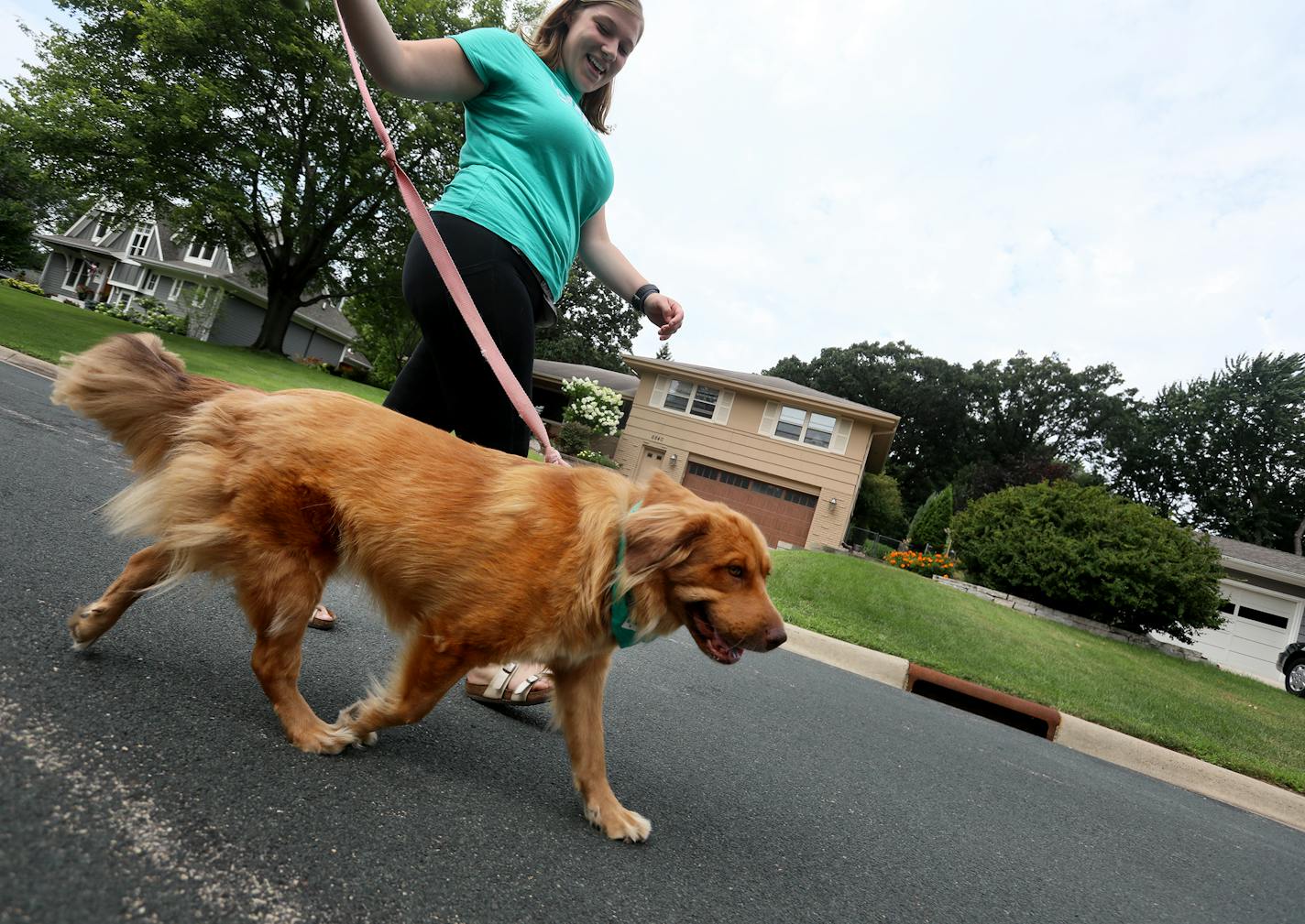 Claire Barczak, 21, works as a dog walker through the Wag app two days a week. Here she walked Chloe, a one-year-old retriever mix.