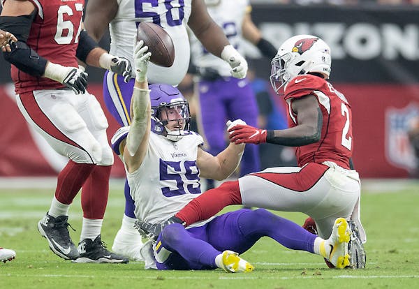 Vikings outside linebacker Nick Vigil (59) thought he recovered the ball as he was taking Cardinals running back Chase Edmonds (2) down in the fourth 