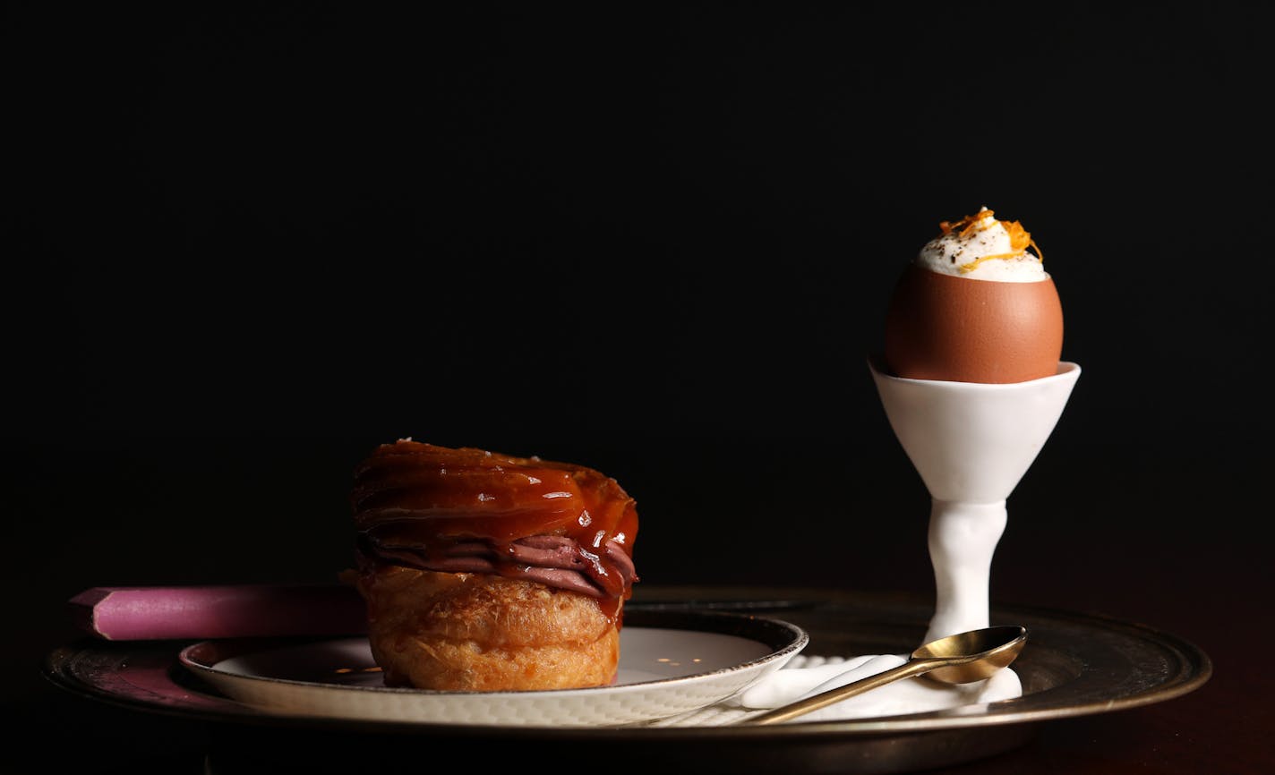 Delights at the Grand Cafe include a chicken liver-filled Paris-Brest with black honey glaze and the foie gras "royale" with tobacco-hinted cream.