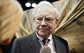 Warren Buffett, chairman of Berkshire Hathaway Inc., tours the exhibition floor prior to the Berkshire Hathaway shareholders meeting in Omaha, Nebrask