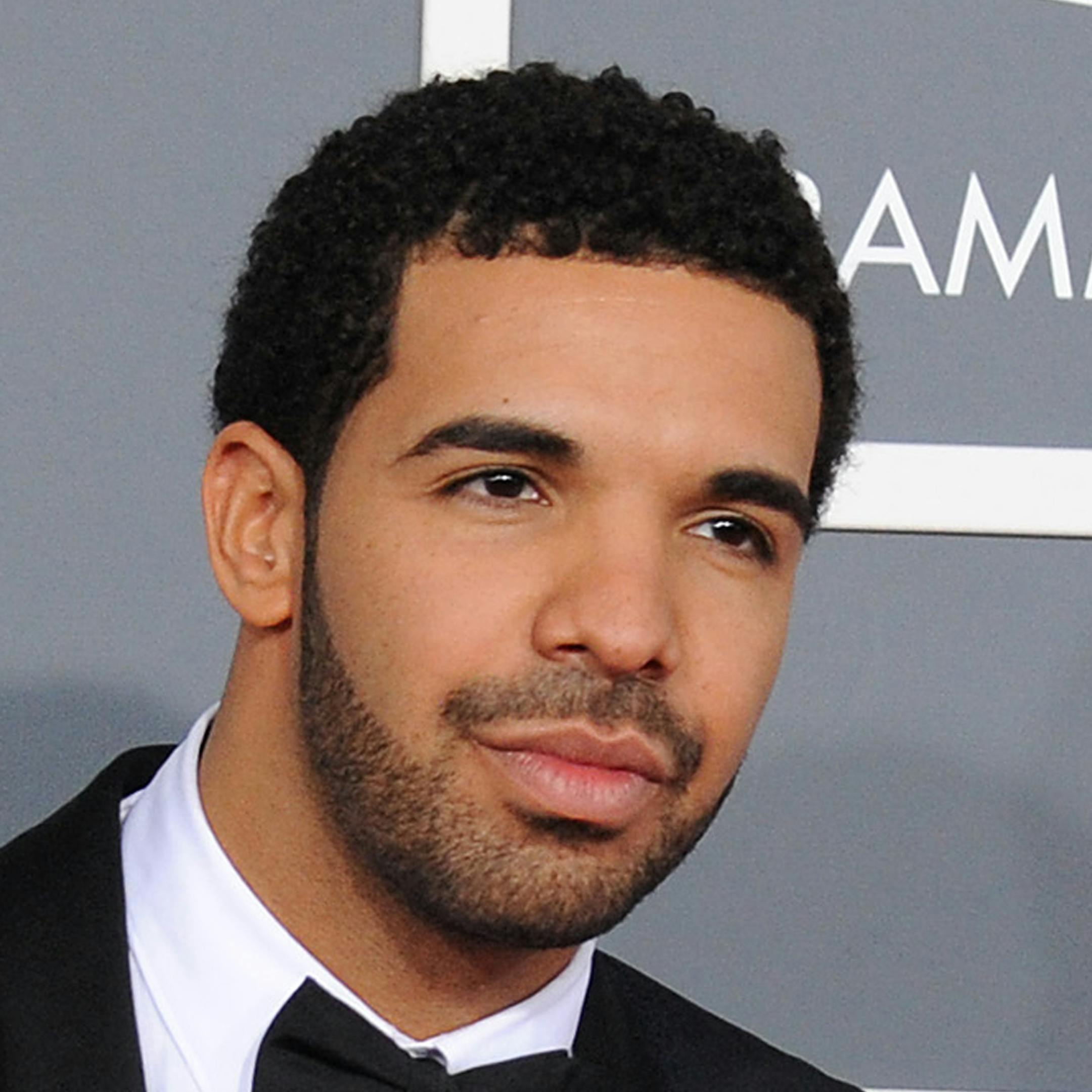 FILE - This Feb. 10, 2013 file photo shows rapper Drake at the 55th annual Grammy Awards in Los Angeles. Drake has been nominated for 12 BET Awards, Tuesday, May 14, 2013. The awards show will air live June 30 from Los Angeles' Nokia Theater L.A. Live. (Photo by Jordan Strauss/Invision/AP, file) ORG XMIT: MIN2013061716143077