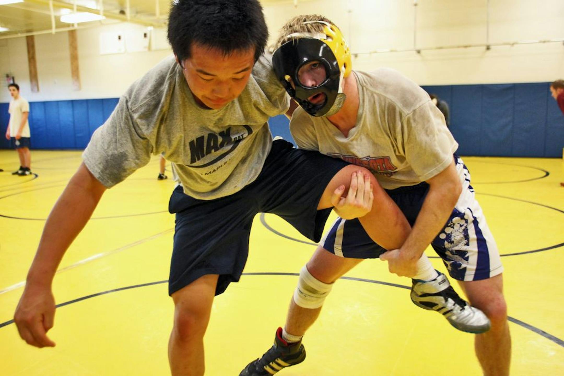 Ben Cousins, right, worked out with Bloomington Kennedy wrestling teammate Zach Bakko in practice. Cousins is ranked No. 6 in Class 3A at 152 pounds.